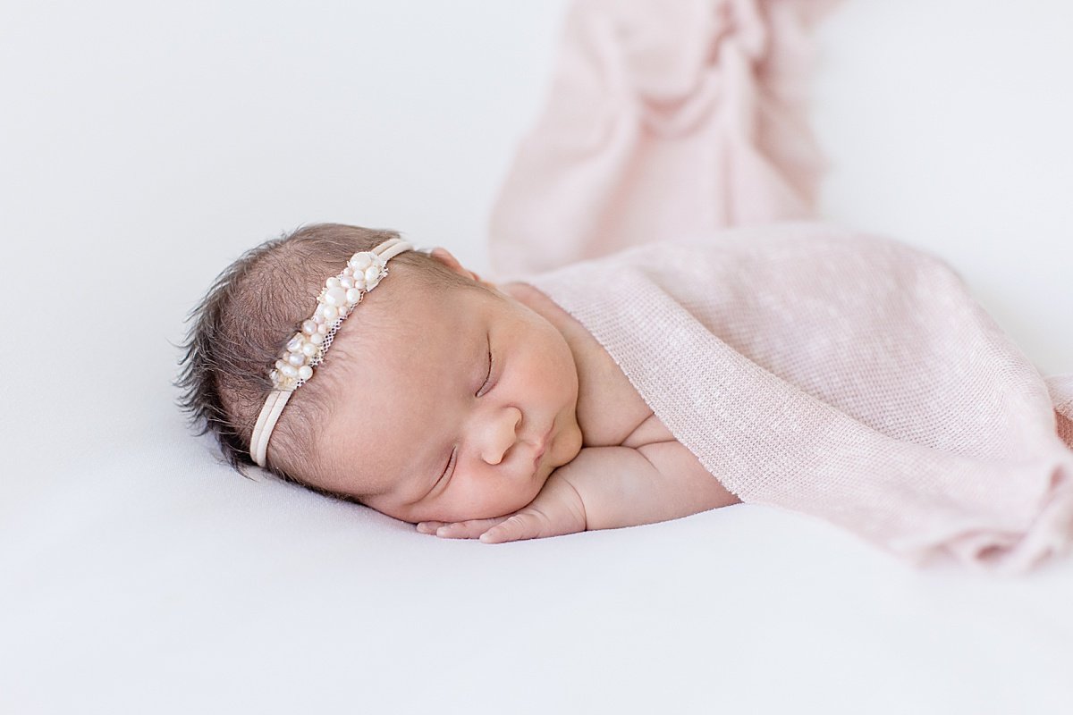 Sleepy Baby Girl Newborn wrapped up in pink blanket | Newport Beach Photographer Ambre Williams