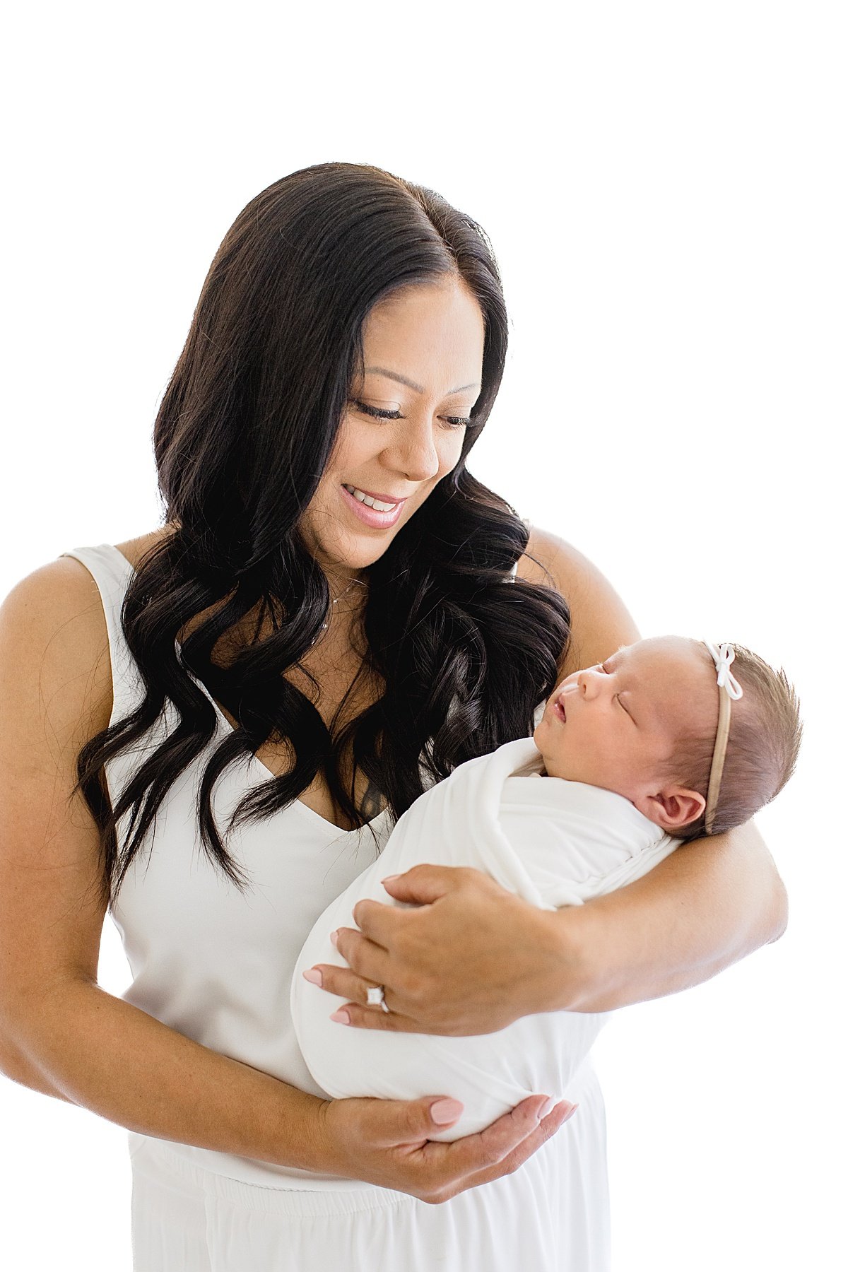 Beautiful Mama holding her newborn baby girl in studio at Newport Beach | Ambre Williams Photography