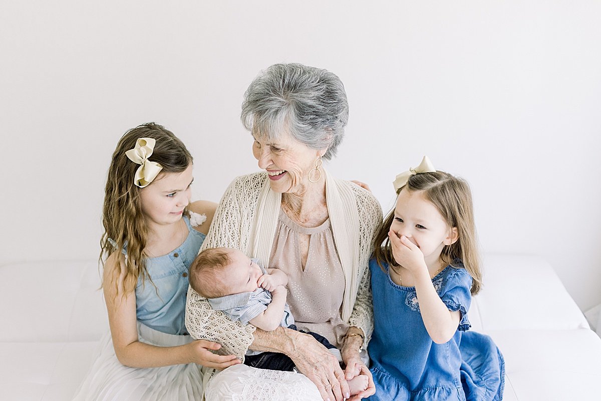 great- grandma with her grandchildren smiling during photography session in studio with Ambre Williams Photography in Newport Beach