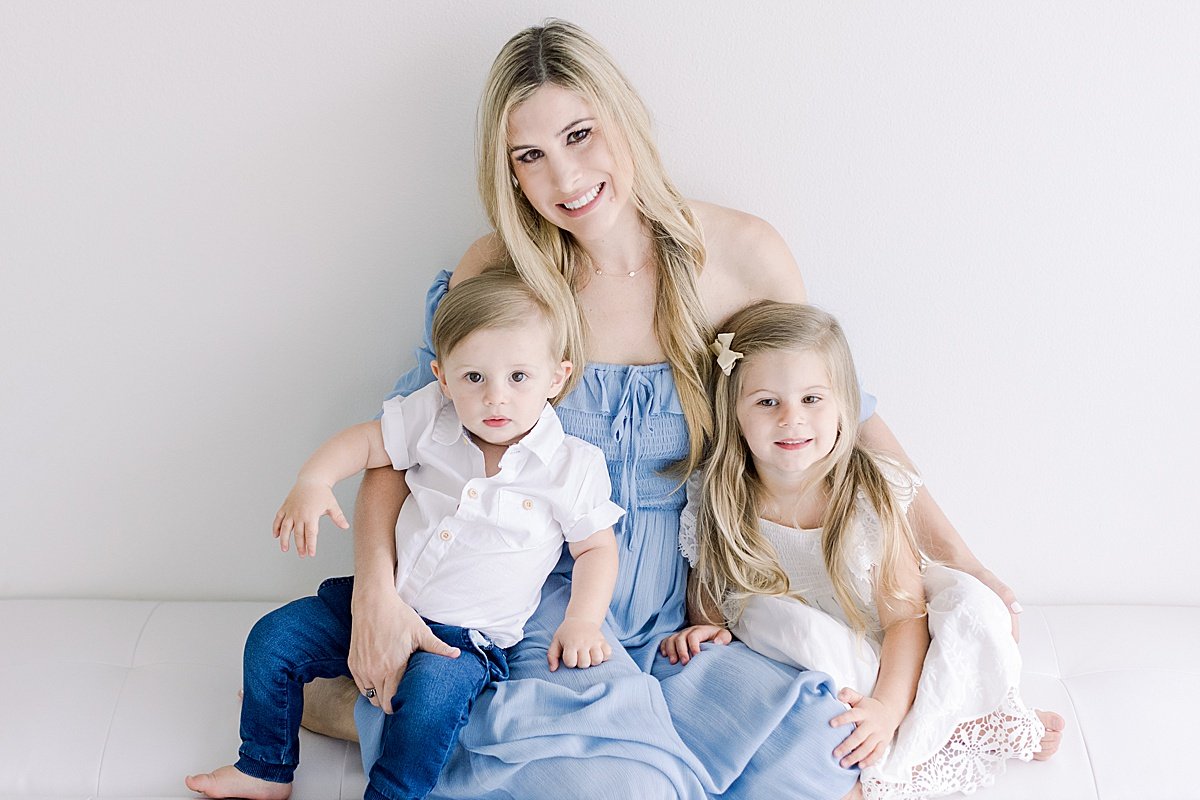 Mom holding her two children for family portrait milestone session with Ambre Williams in Newport Beach Studio | Perfect gift for grandparents