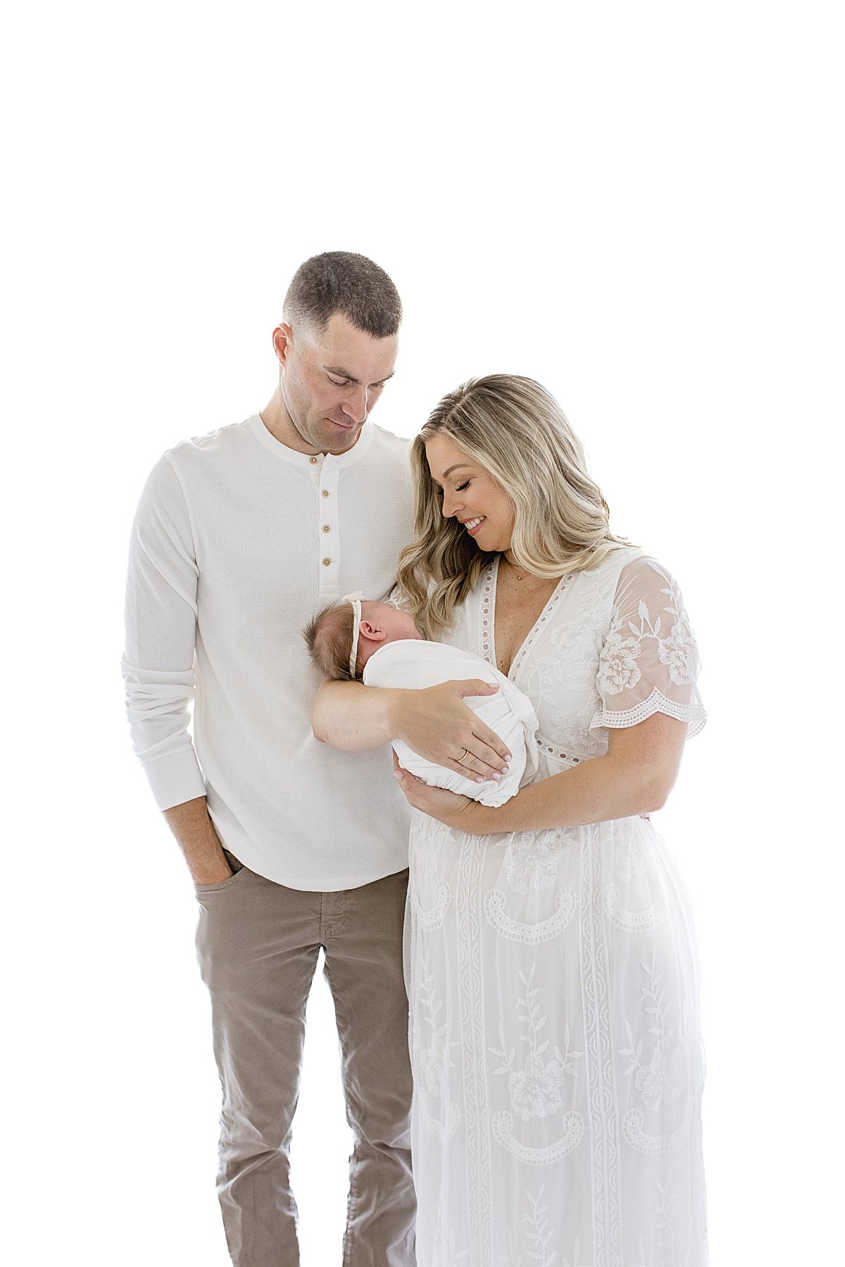 happy new parents smiling at their baby daughter | Newport Beach Photographer Ambre Williams