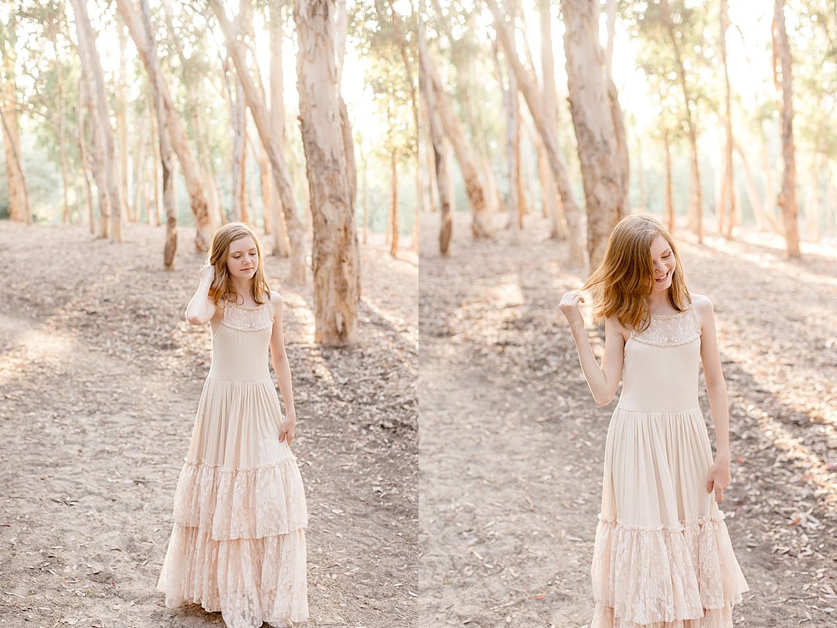 youngest daughter twirling in long dress during portrait session with Ambre Williams candid photography