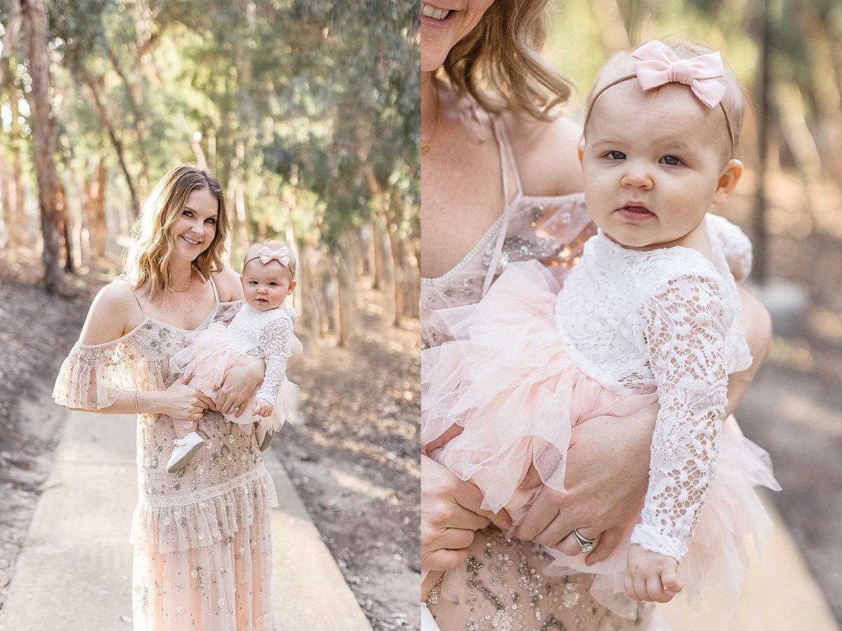 Beautiful Momma holding her young daughter in outdoor session with Ambre Williams Photography in Newport Beach California