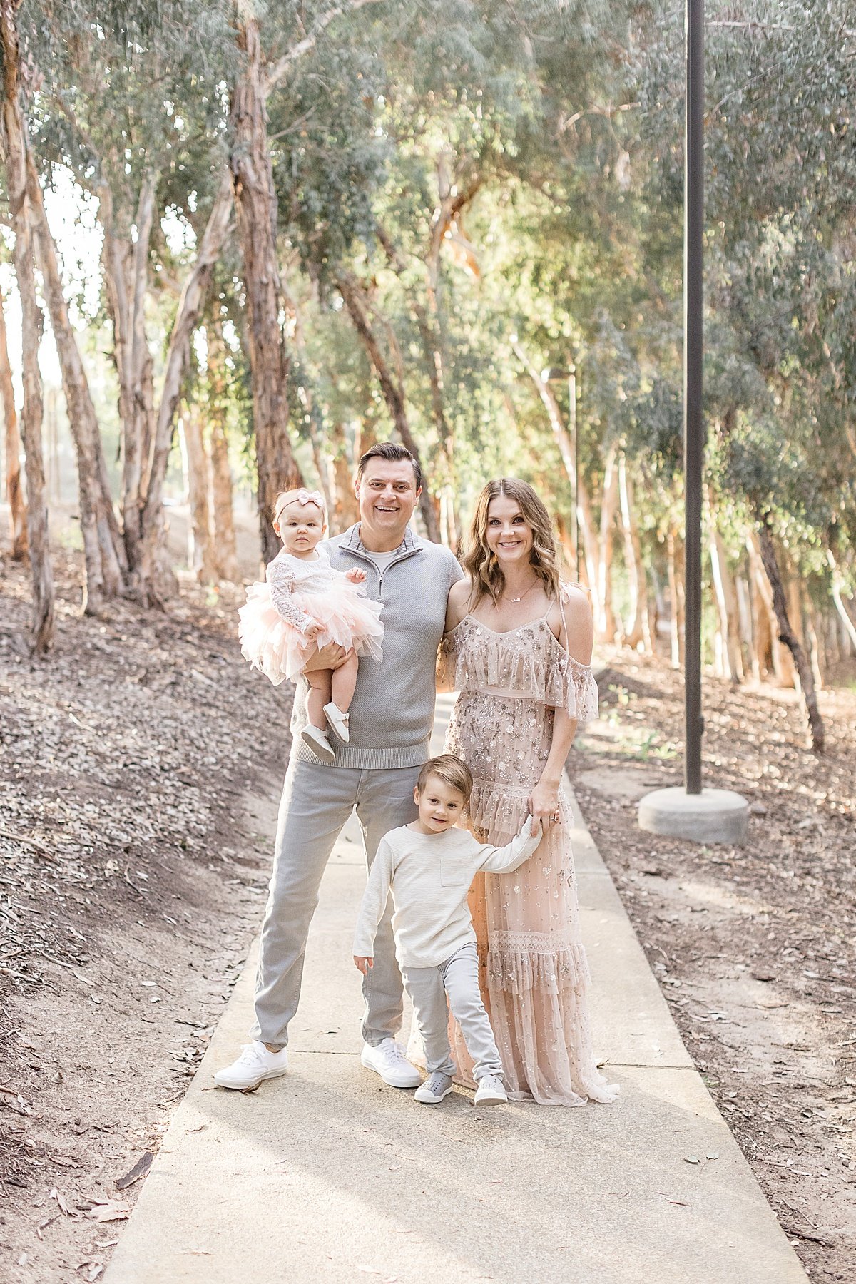 Fall family portrait in california forest photographed by Ambre Williams Photography