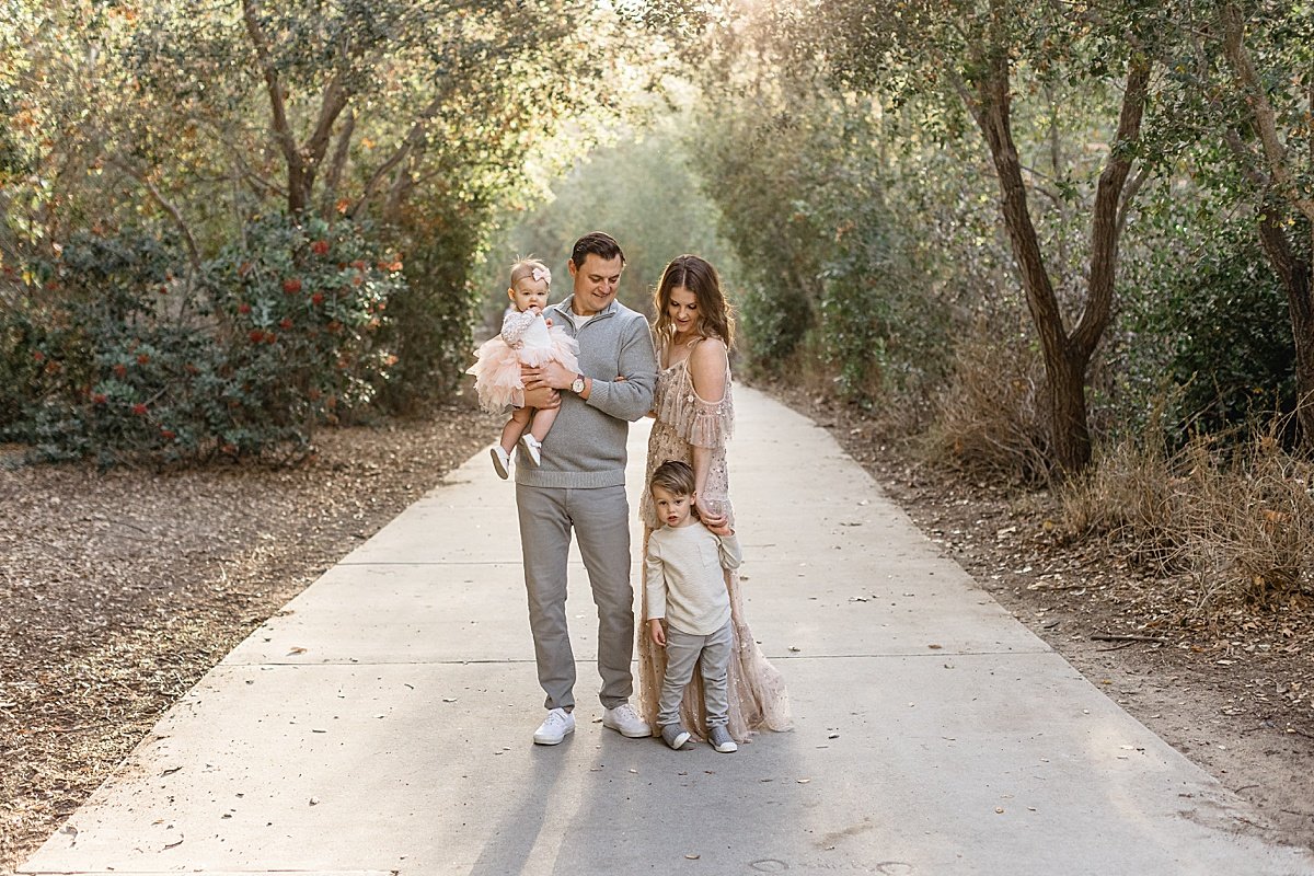 Candid family portrait in Lake Forest with Ambre Williams Photography in California forest