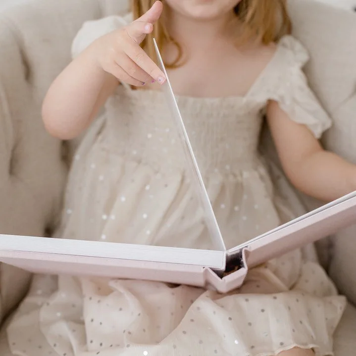 Albums are a personal favorite of mine! They really allow you to tell a story. Whether it&rsquo;s your baby&rsquo;s first year or your family&rsquo;s annual portraits made into an album. Our luxury handmade, high-quality lay flat albums are designed 