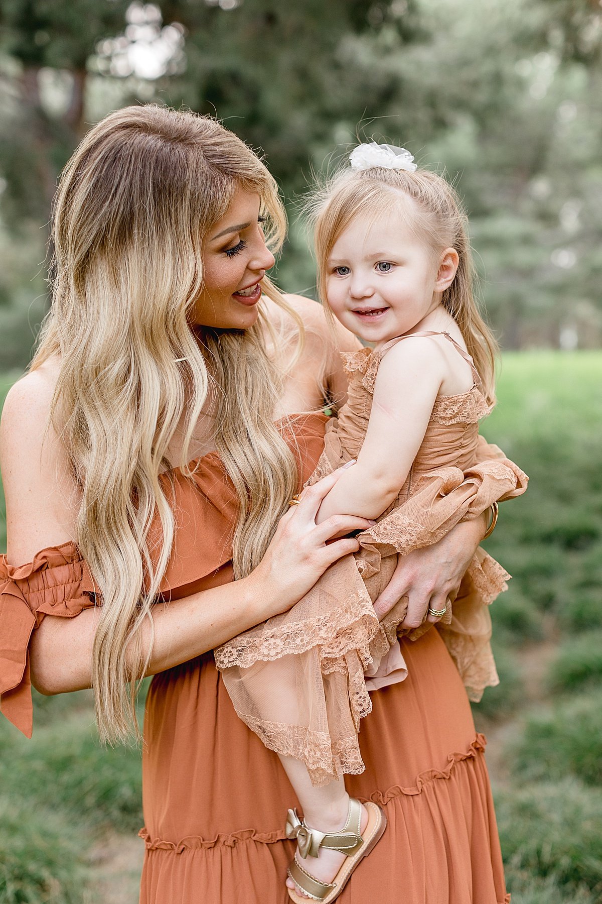 Mom and daughter hugging each other in Newport Beach fall portrait session in Lake Forest 