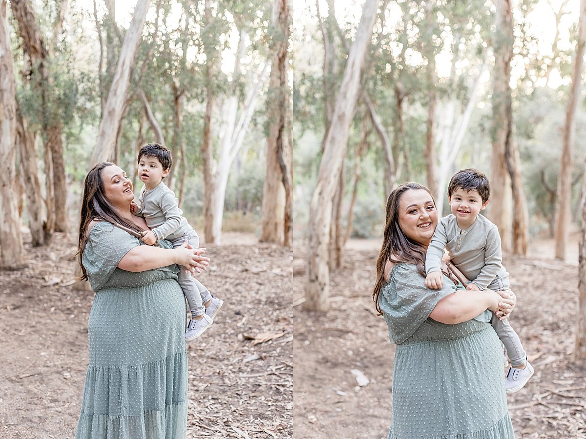 Mom holding son during outdoor fall portrait session in Lake Forest, California with Ambre Williams Photography