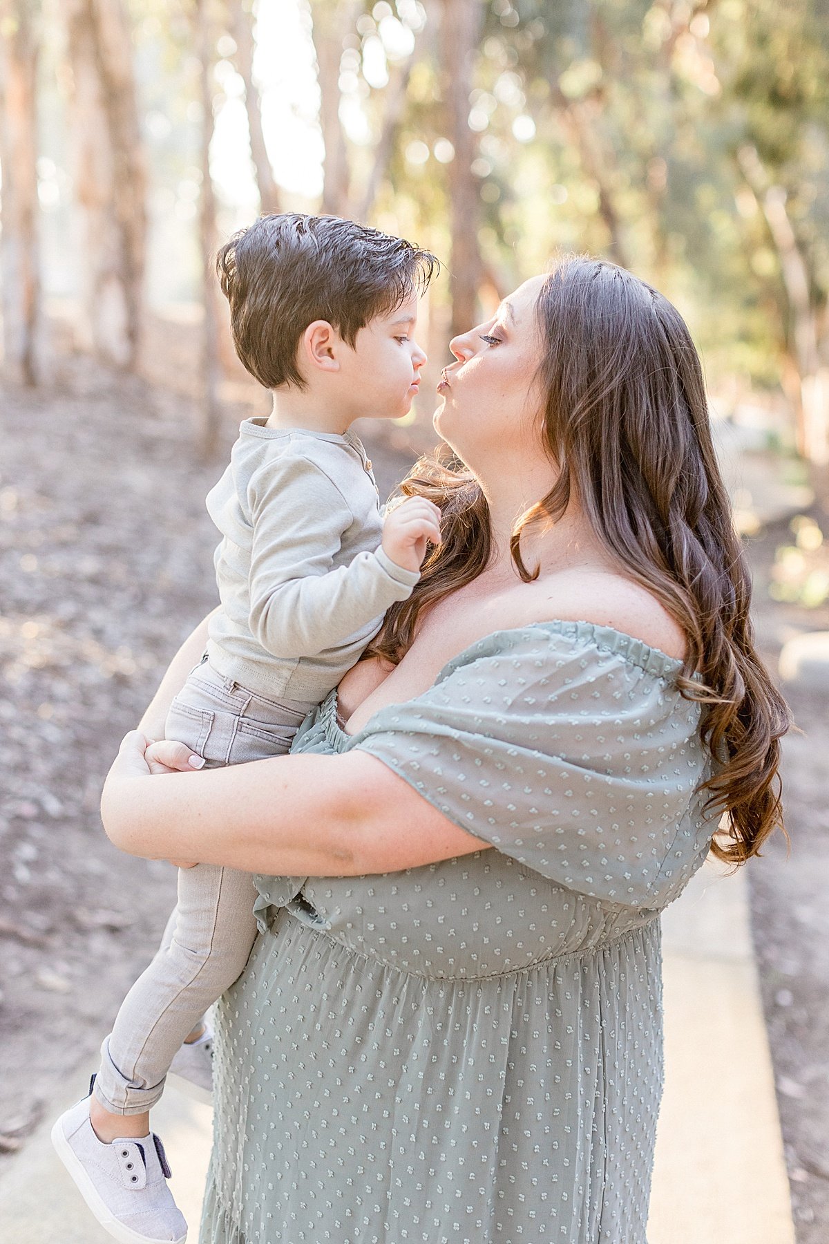 Mother son candid portrait in outdoor portrait session with Ambre Williams Photography near Newport Beach