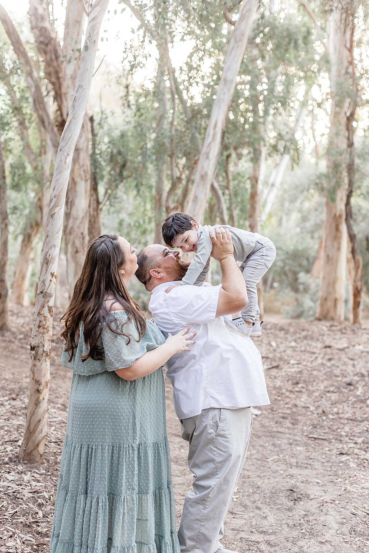 Candid family portrait laughing together during Ambre Williams Fall Family portrait session in Lake Forest, California