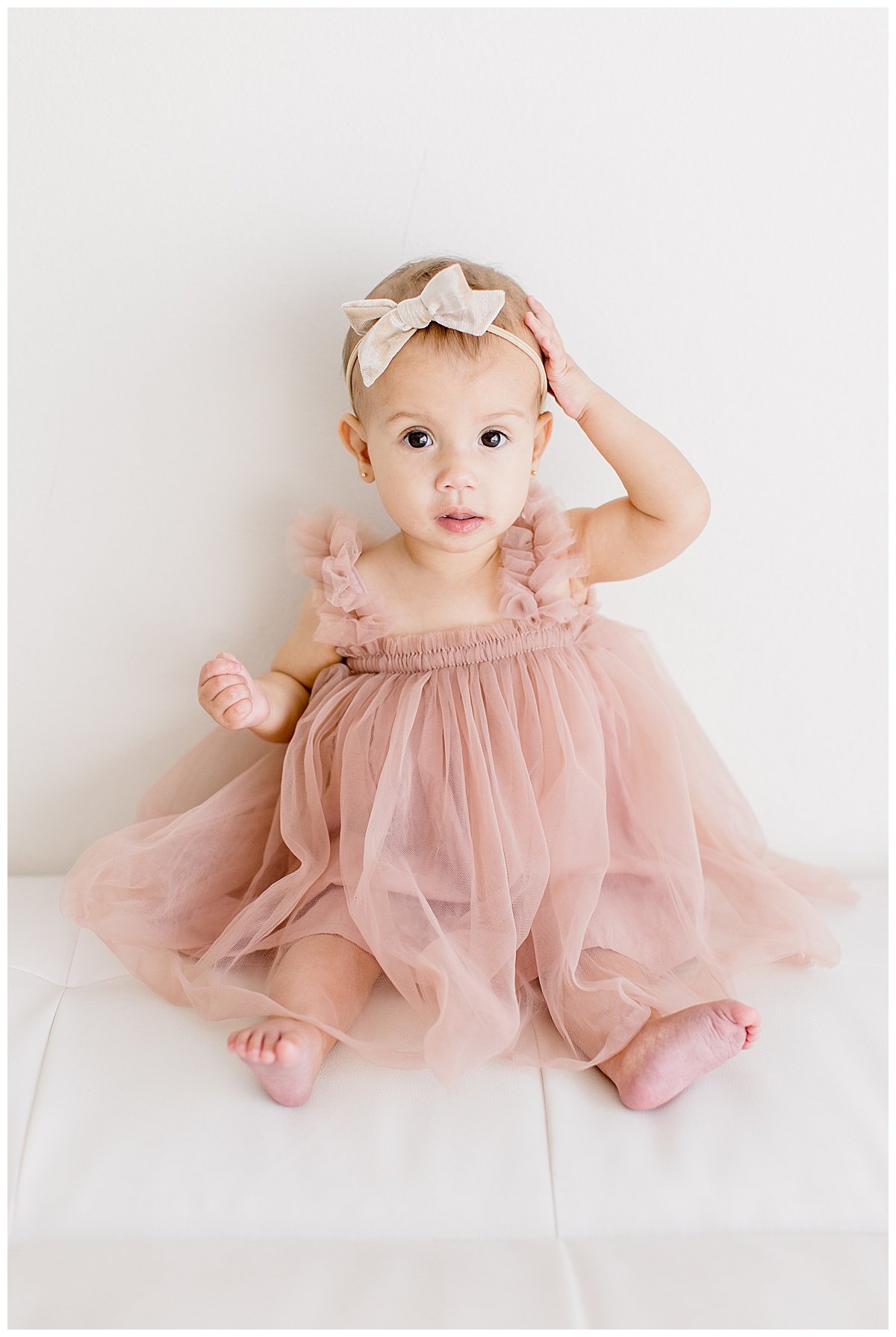 one year old in blush tulle dress with Ambre Williams Photography