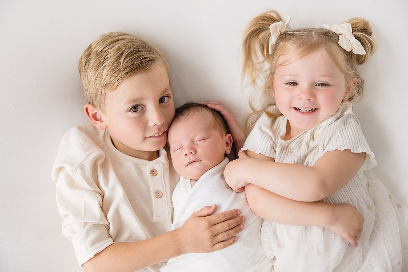 Siblings with Baby Brother Newborn Session | Ambre Williams Photography