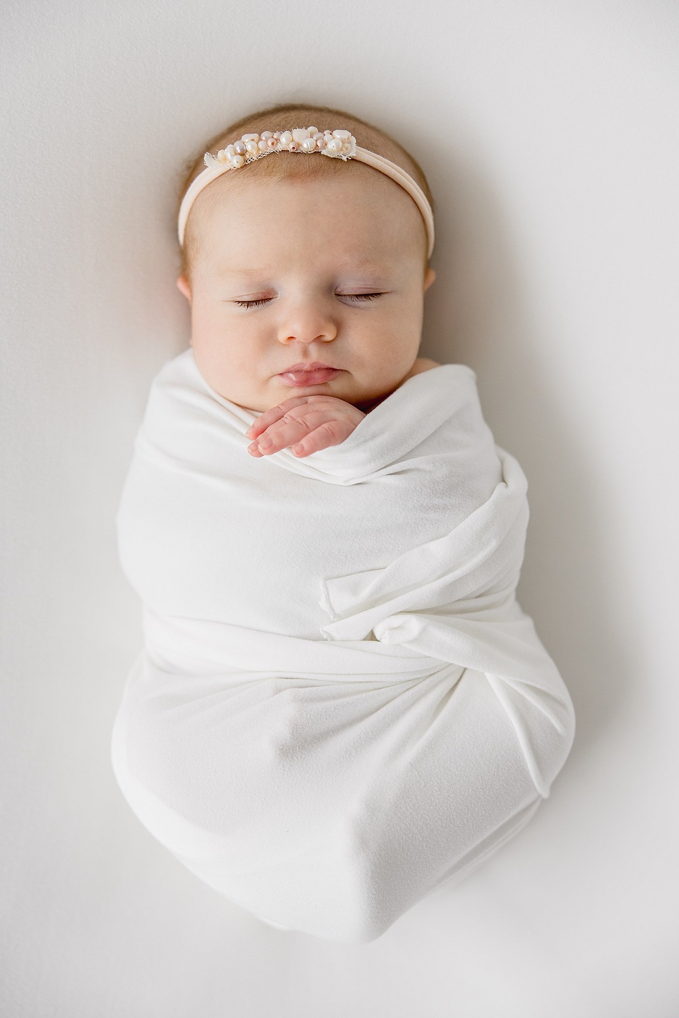 Baby Girl in Swaddle | Ambre Williams Photography