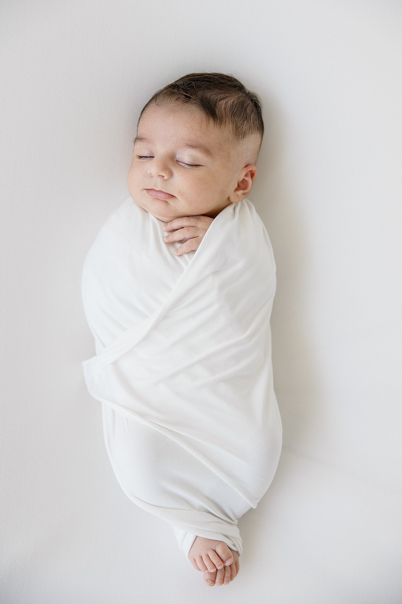 Newborn Baby Boy In Swaddle With Ambre Williams Photography