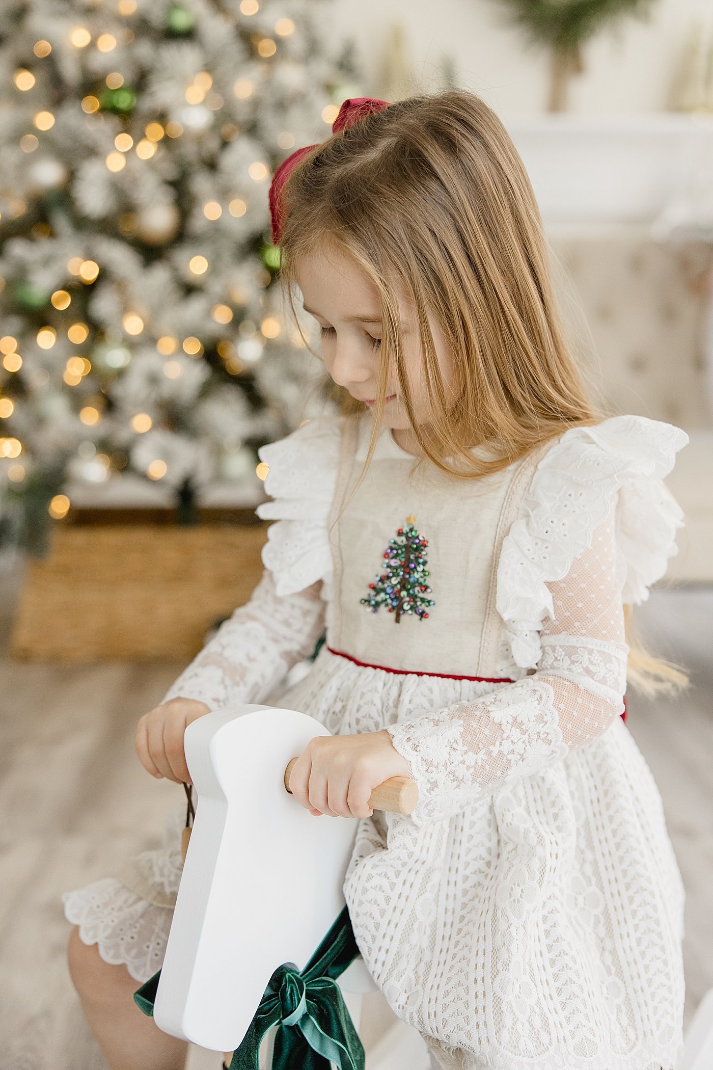 Santa Session with Little Girl On Rocking Horse | Ambre Williams Photography