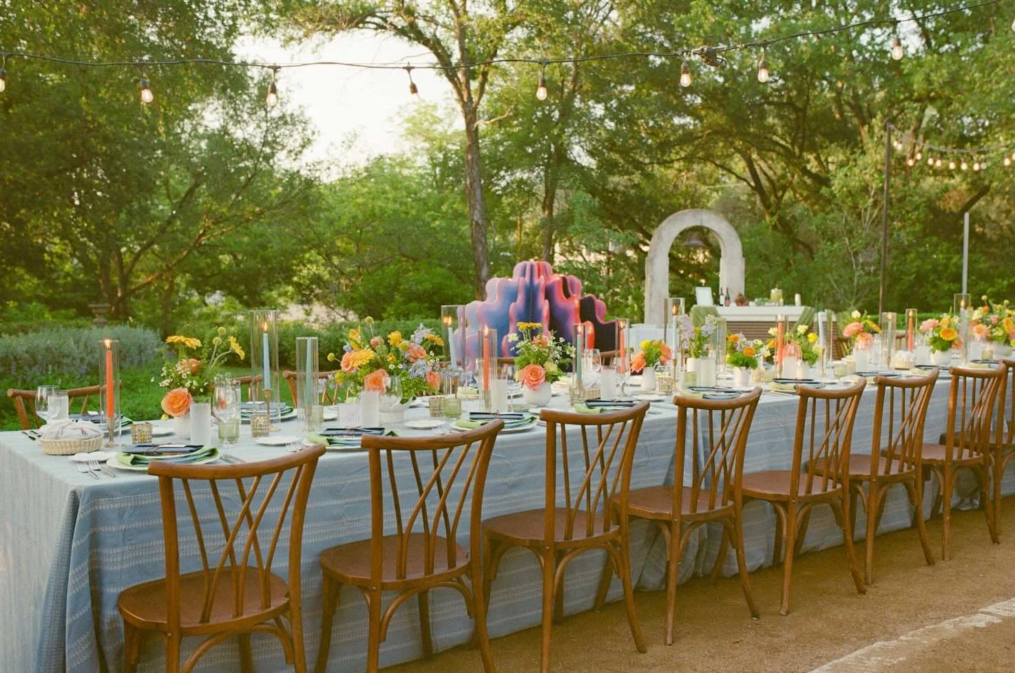 The dinner table waiting for Megan &amp; Tyler&rsquo;s guests down at cocktail hour. ✨

Also &mdash; the sculpture you see centered in the first photo is part of an installation currently at @lagunagloriagrounds, and it was created by @lauralitart, w