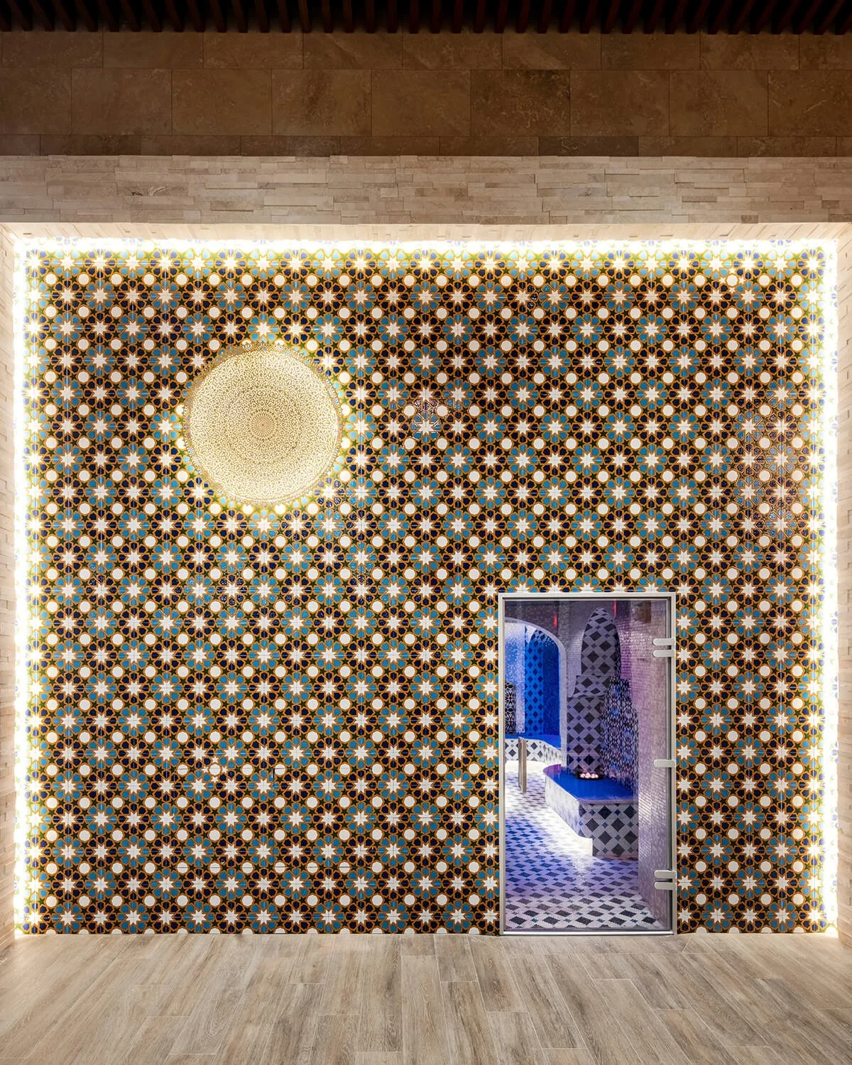 Mosaic-tiled spa steam room entrance, highlighting wellness architecture by Brian Berkowitz