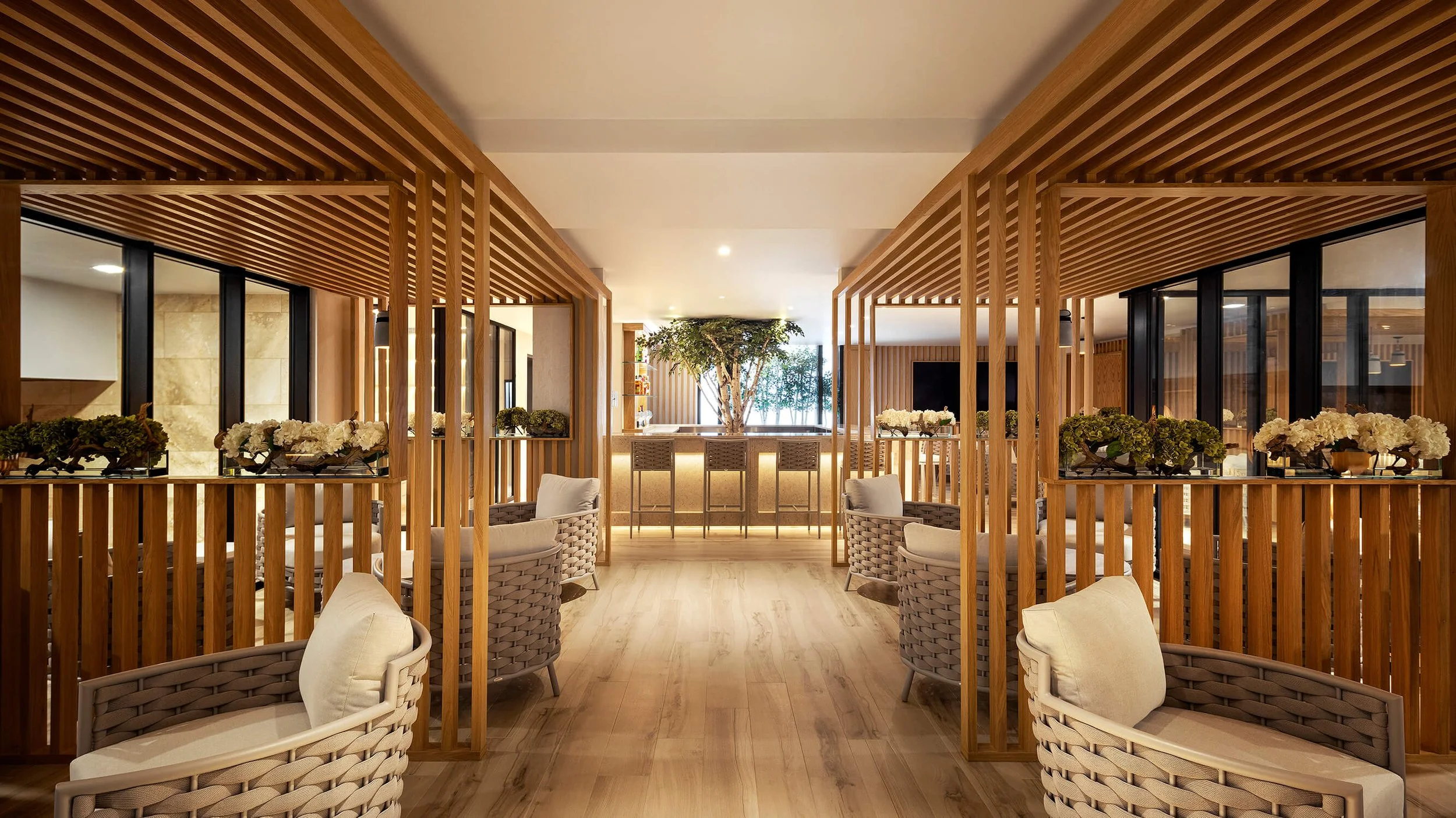 Elegant spa lounge with natural wood accents and soft seating, captured by Brian Berkowitz Photography.