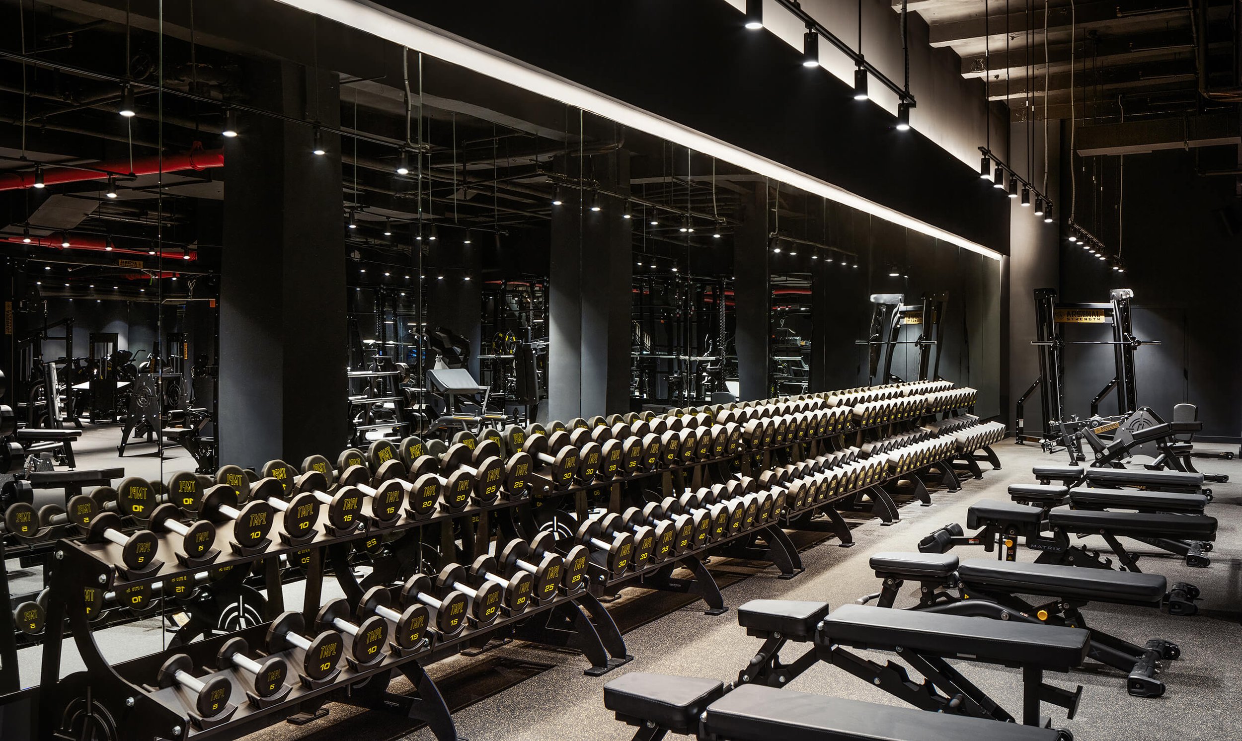 Modern gym weight training area showcasing health and wellness design by Hospitality Photographer New York City