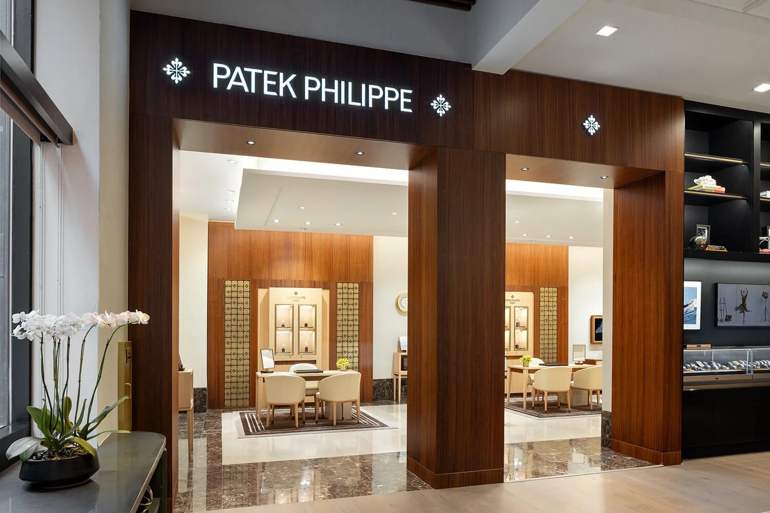 Wide-angle view of Patek Philippe boutique, highlighting luxury retail interior design.