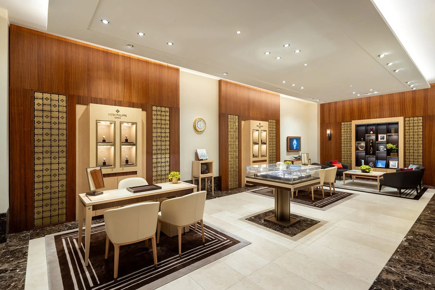Interior shot of Patek Philippe boutique, showcasing watch displays and elegant seating areas.