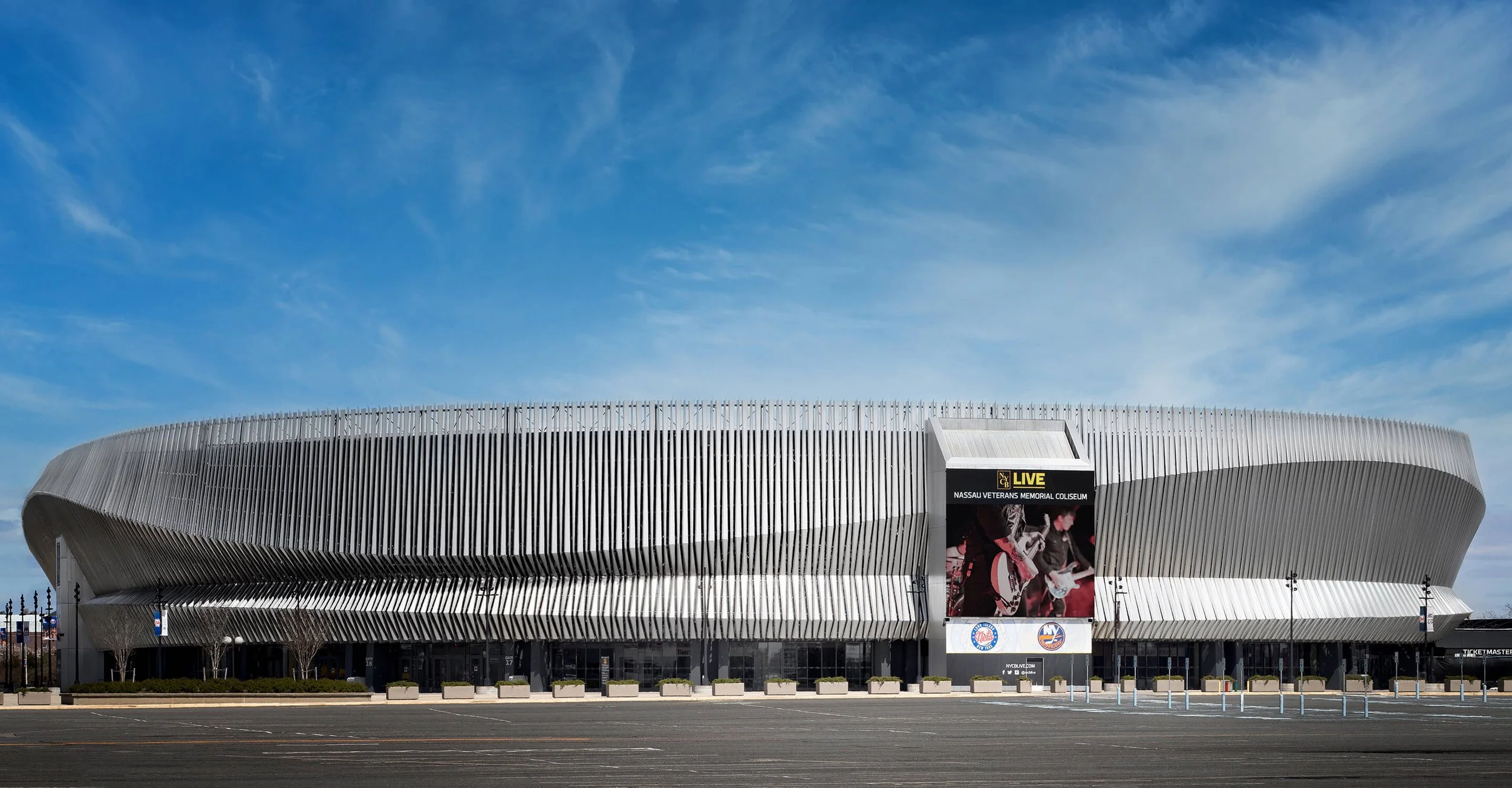 Nassau Coliseum exterior with sweeping aluminum fin facade, commercial architectural photography by Brian Berkowitz Photography Long Island