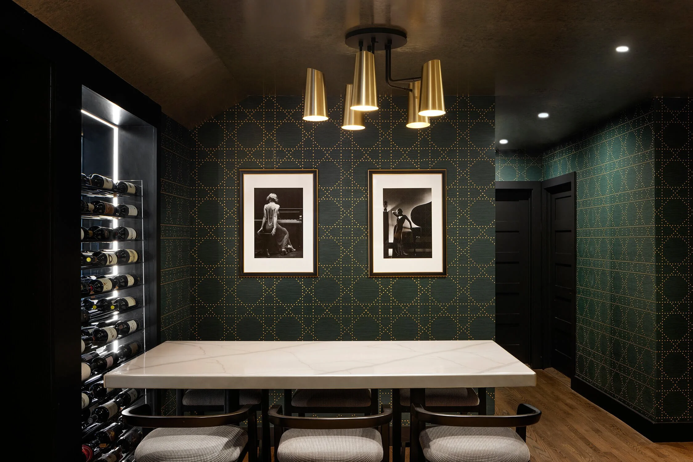 Custom wine room with green patterned wallpaper and gold pendants, residential interior photography, New York