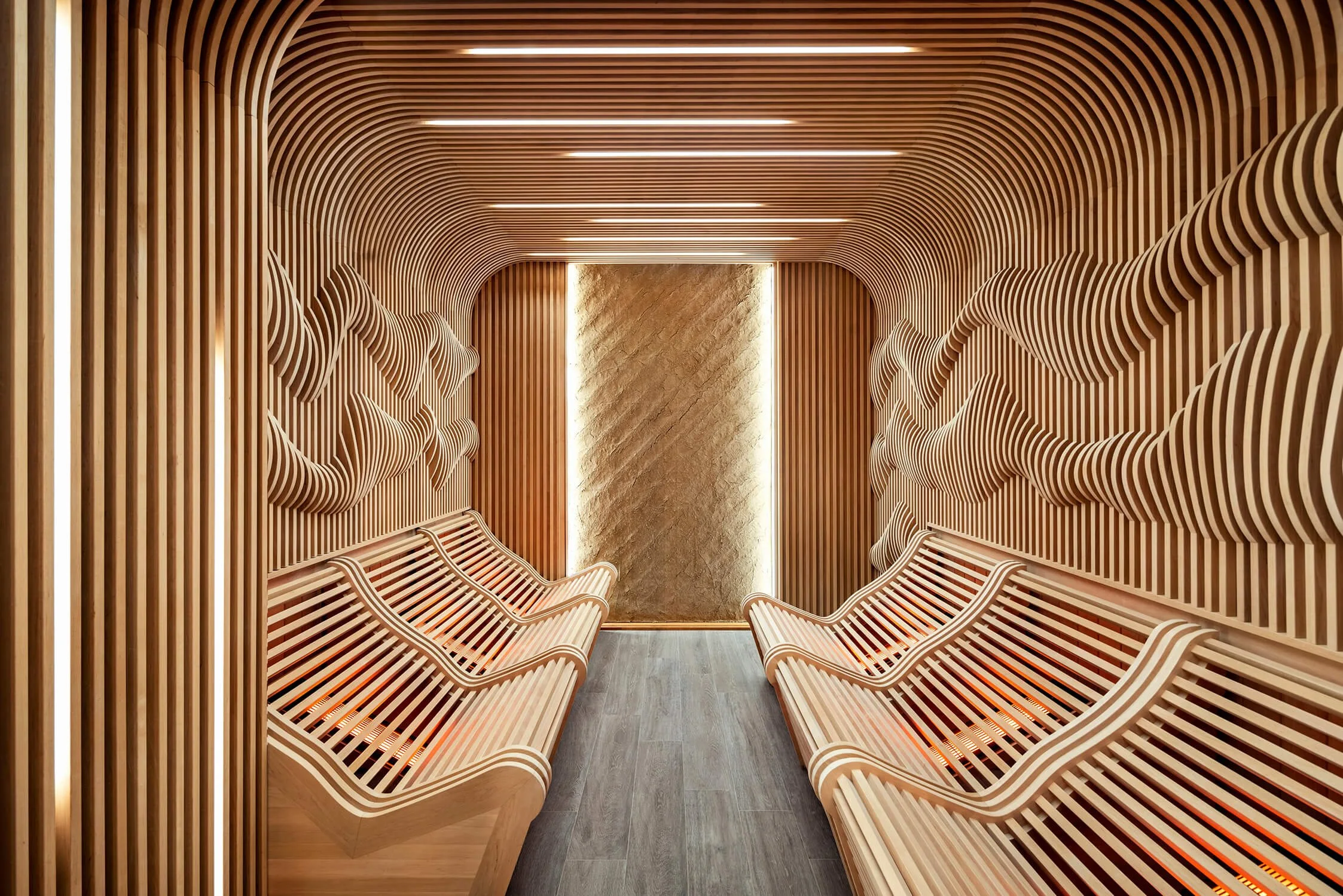 Contemporary infrared sauna relaxation room with sculptural wood seating by Commercial Architecture Photographer NYC