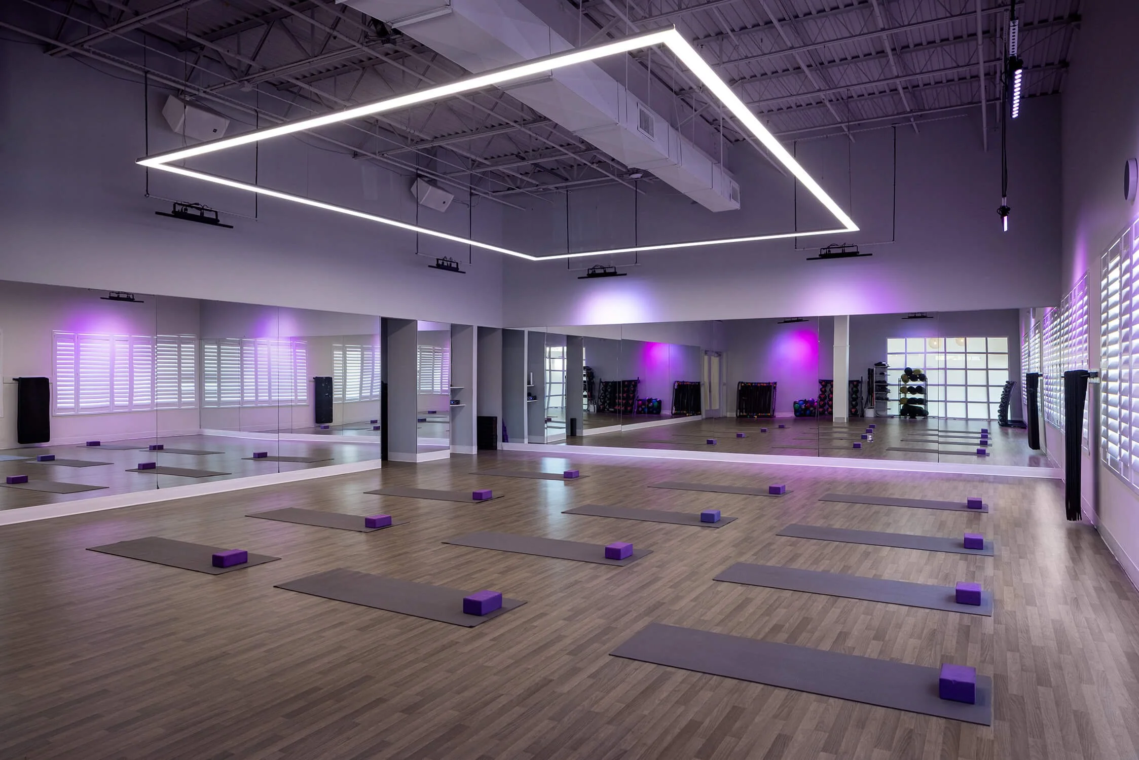 Yoga studio with ambient lighting designed for wellness, photographed by Brian Berkowitz