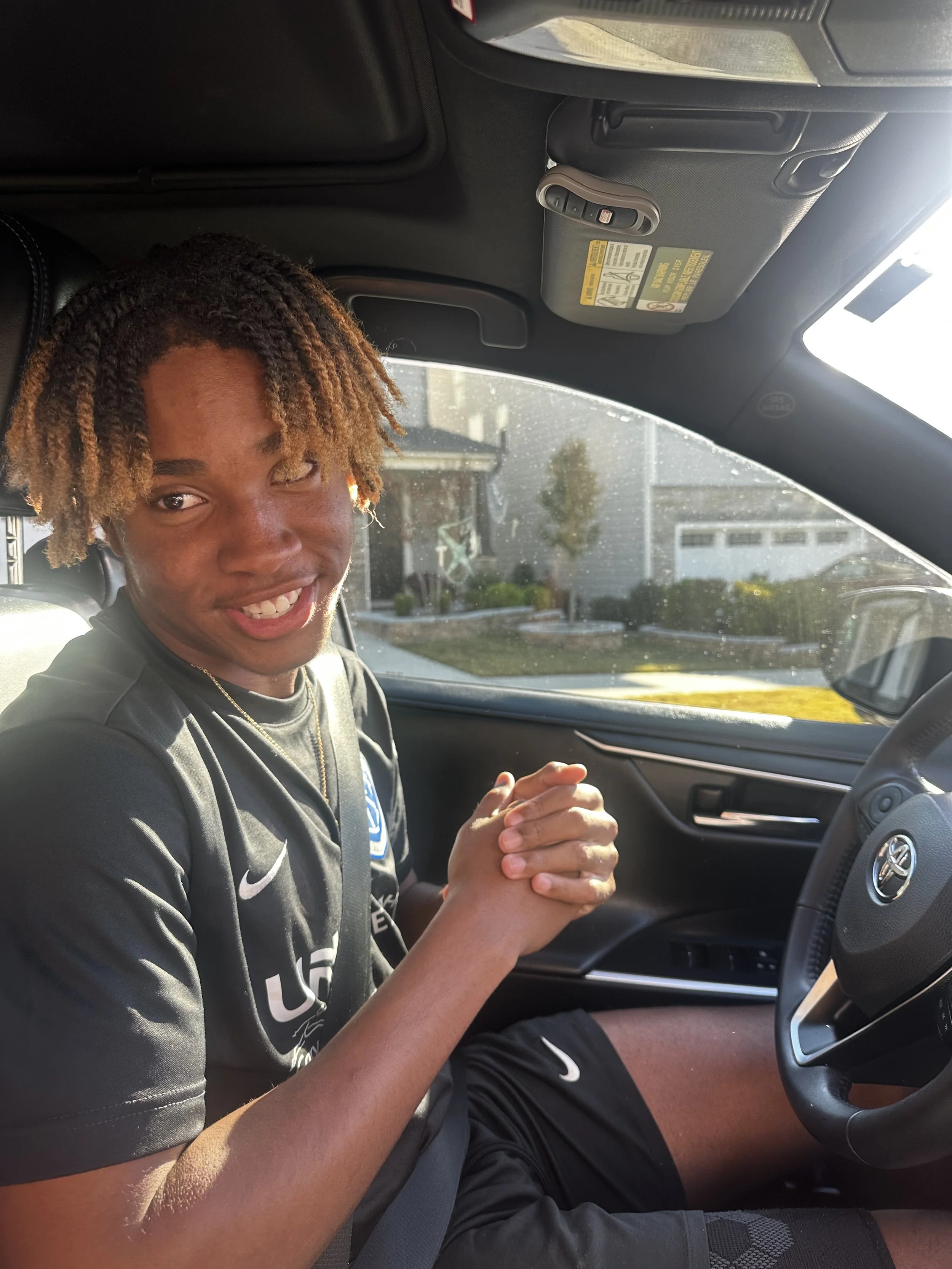 E behind the wheel after getting his license.