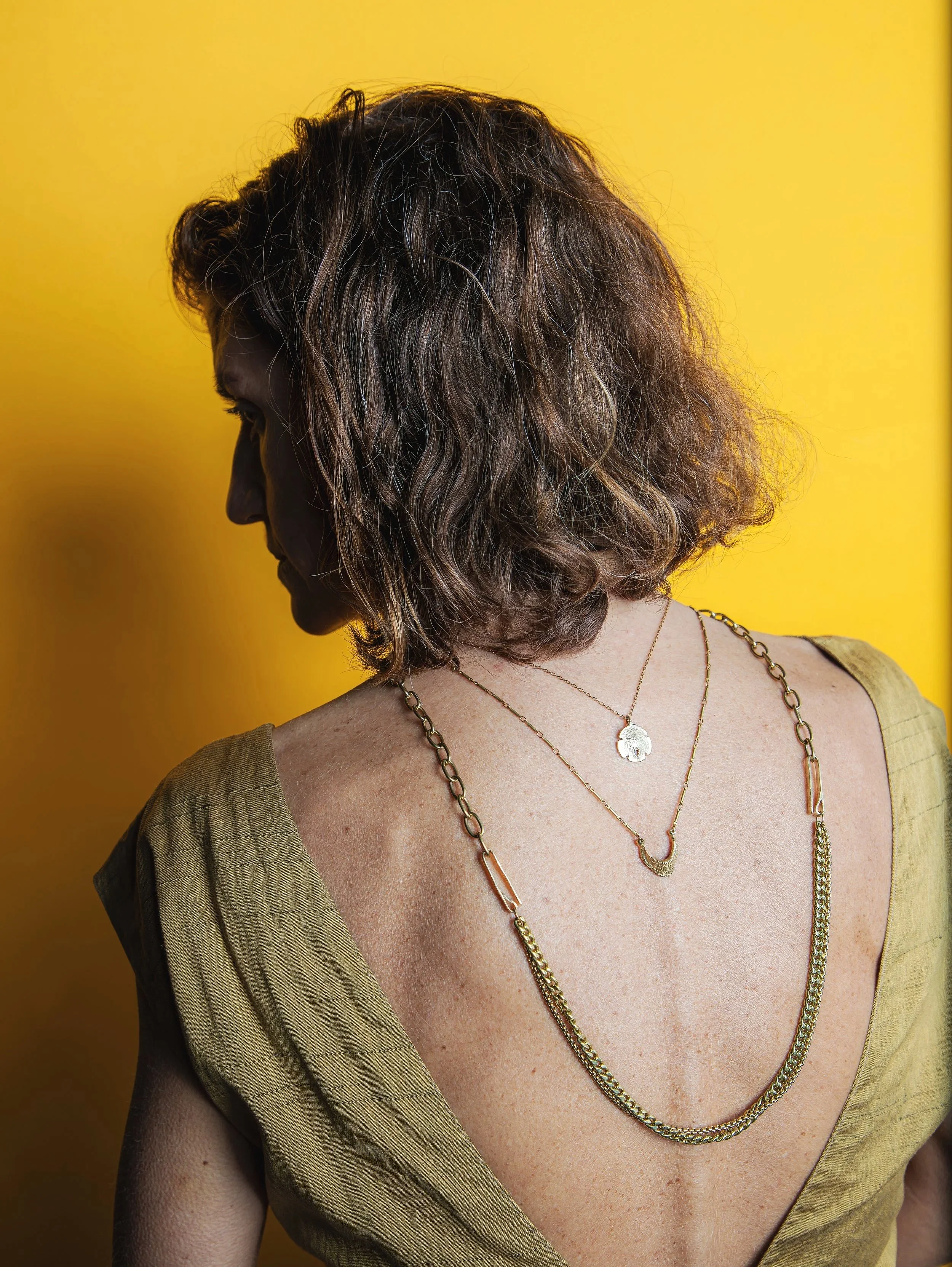 Artist Leah Rosenberg wearing jewelry by Water Sand Stone. Spring 2026.
www.leahrosenberg.com