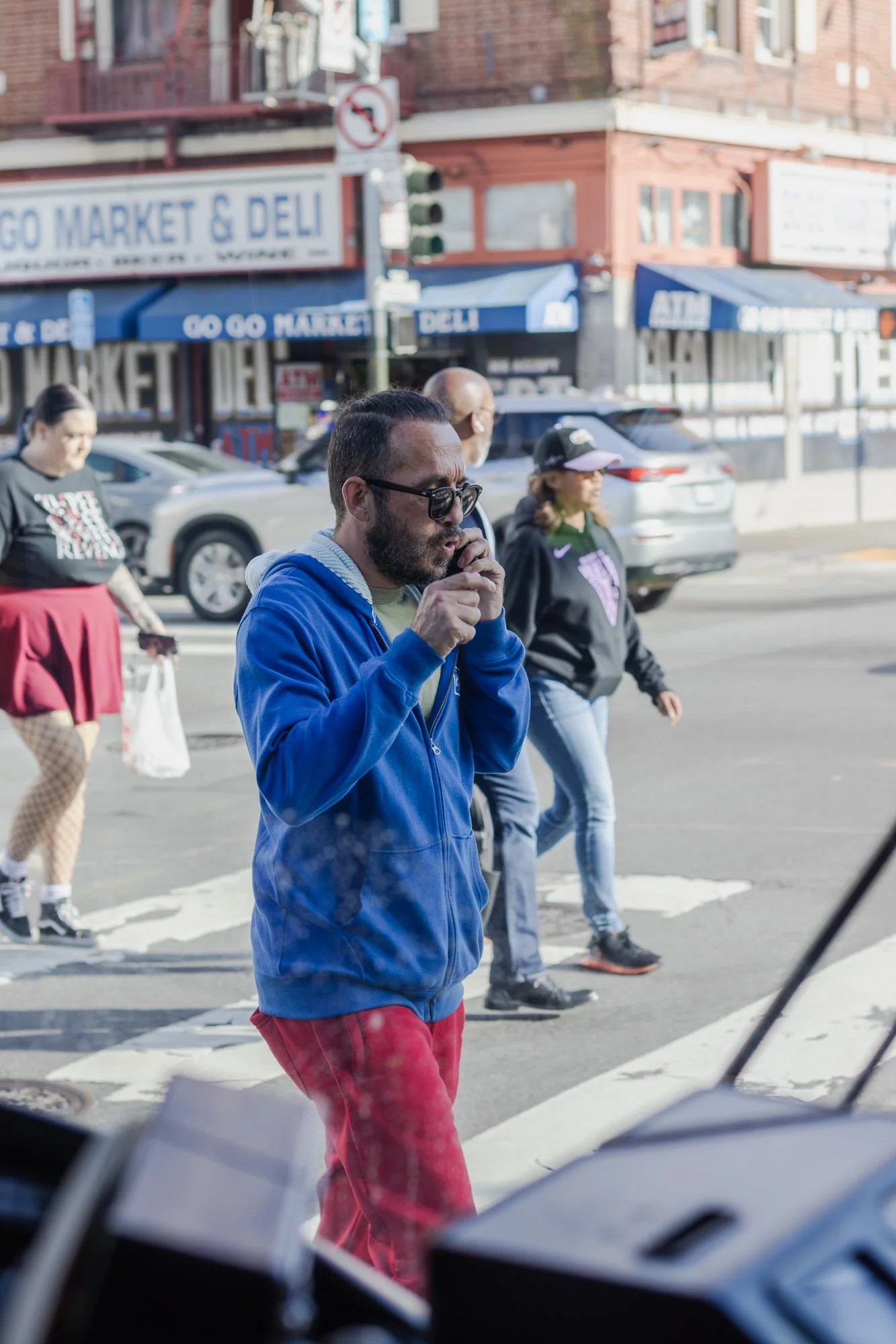 People crossing Mission Street in busy SOMA, as seen from the front of the 9 bus. 
From 'Doors Are Opening' project, in progress. October 2026.