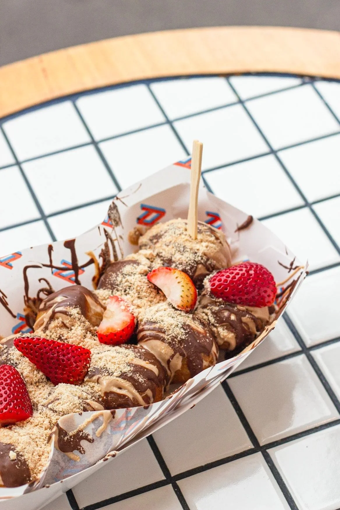 The All Good by Drizzl’d, freshly made hot ball doughnuts topped with strawberries, Bueno pieces, chocolate drizzle and premium toppings. One of Melbourne’s most popular late night desserts for customers searching desserts near me, desserts open now