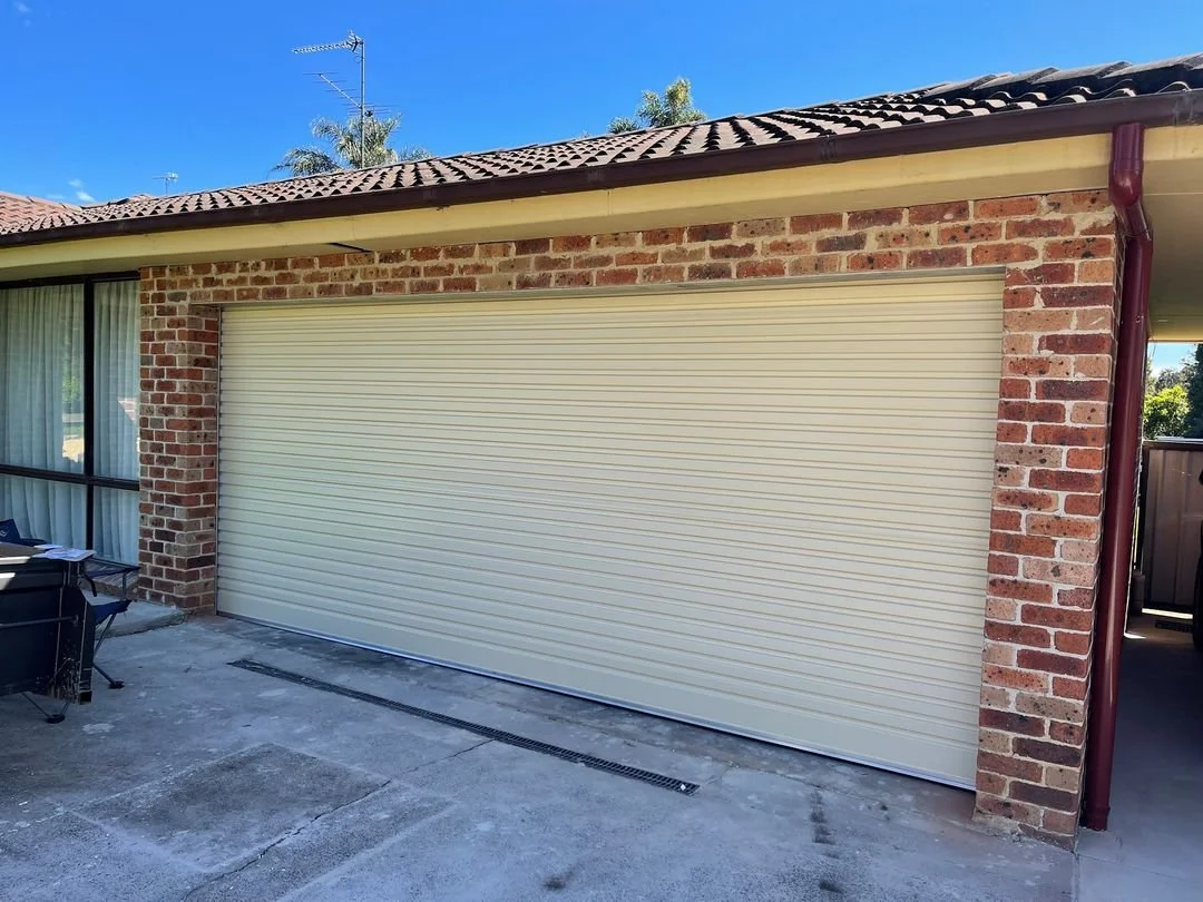 When should a garage door be serviced?