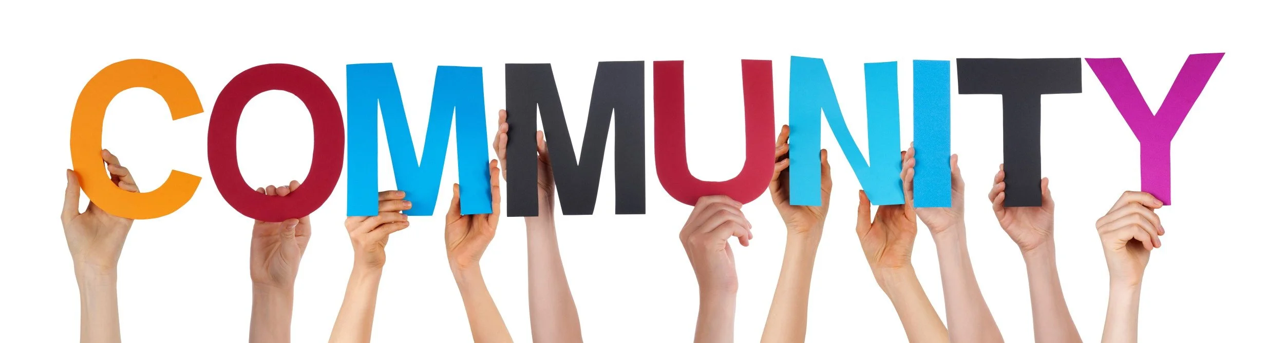 Hands holding up the words Community