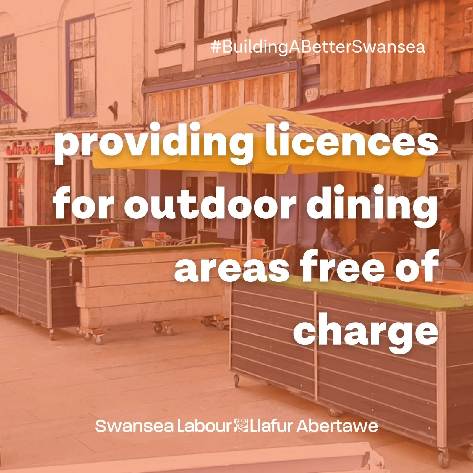 Text saying providing licences for outdoor dining areas free of charg. Image of outdoor diners behind. Swansea Labour.