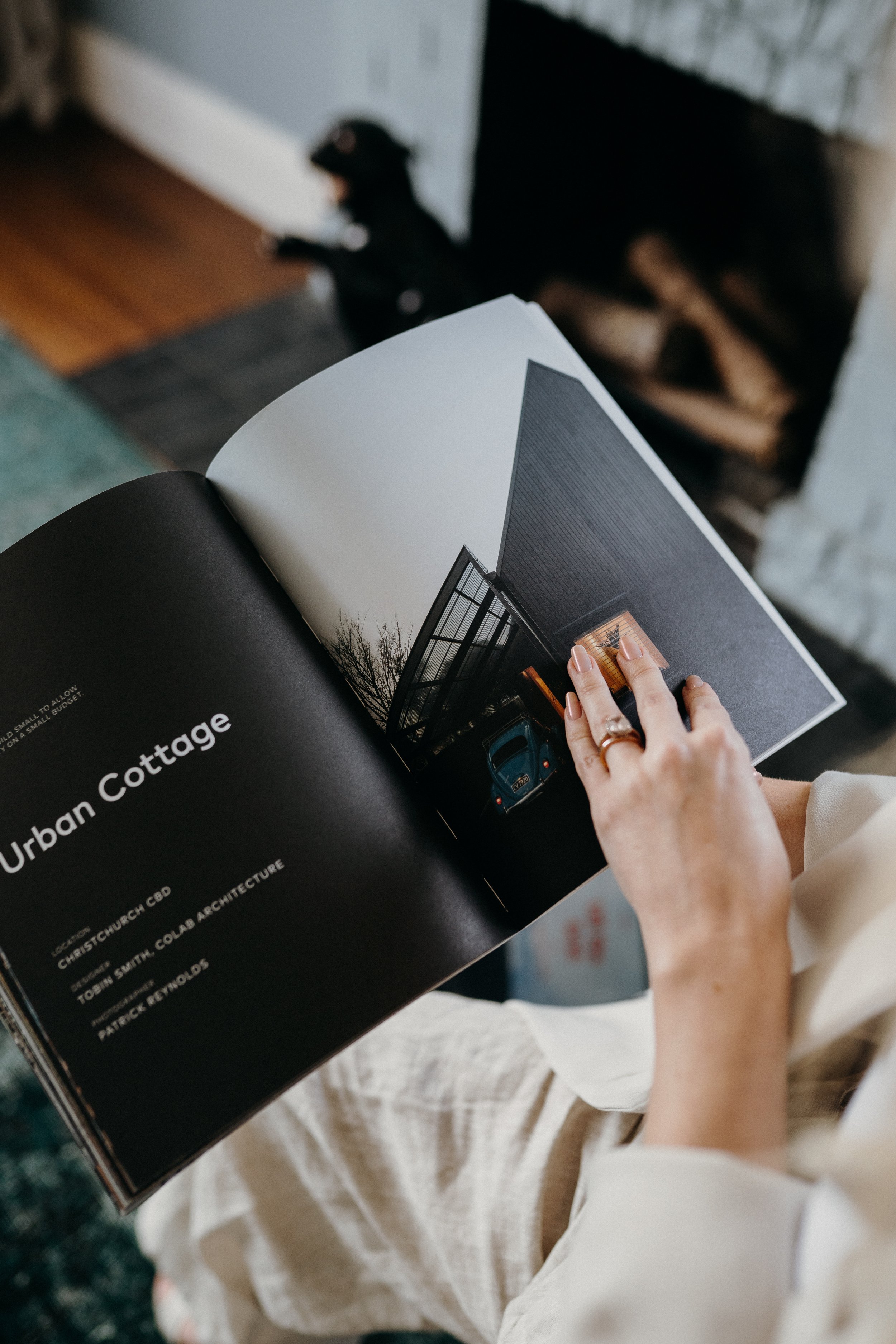 woman holding magazine