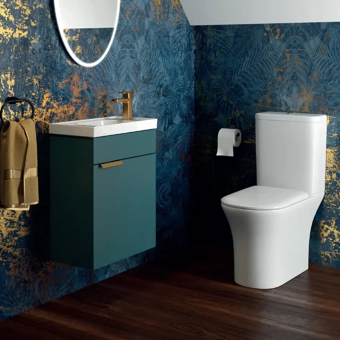 Toilet and vanity unit with blue feature wall at Island Bathrooms Bournemouth
