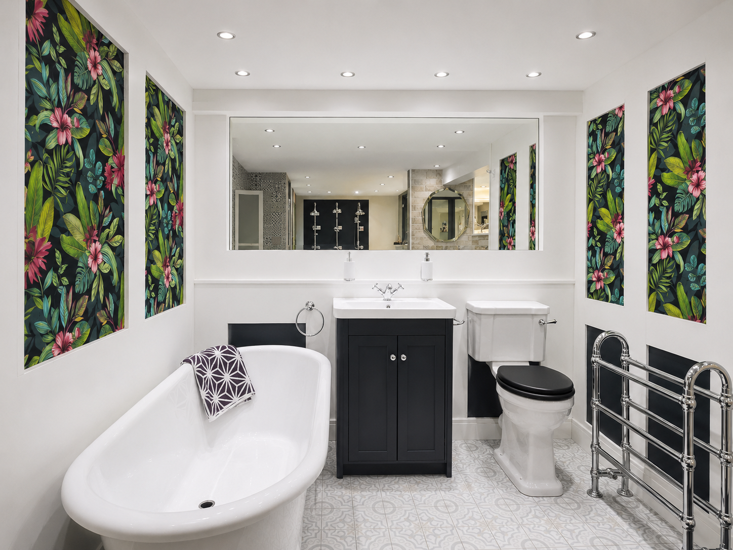 Modern bathroom with a white clawfoot bathtub, black vanity with white sink, white toilet with black seat, chrome towel rack, floral wall art, large mirror, and shower area in the background.