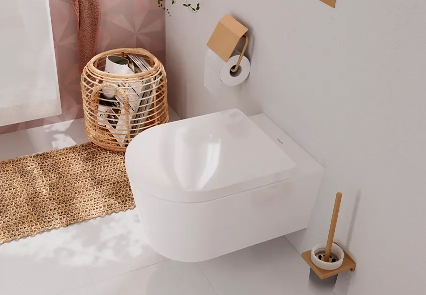 Modern white toilet in a bathroom with a woven basket, a beige carpet, and a minimalist toilet brush holder.