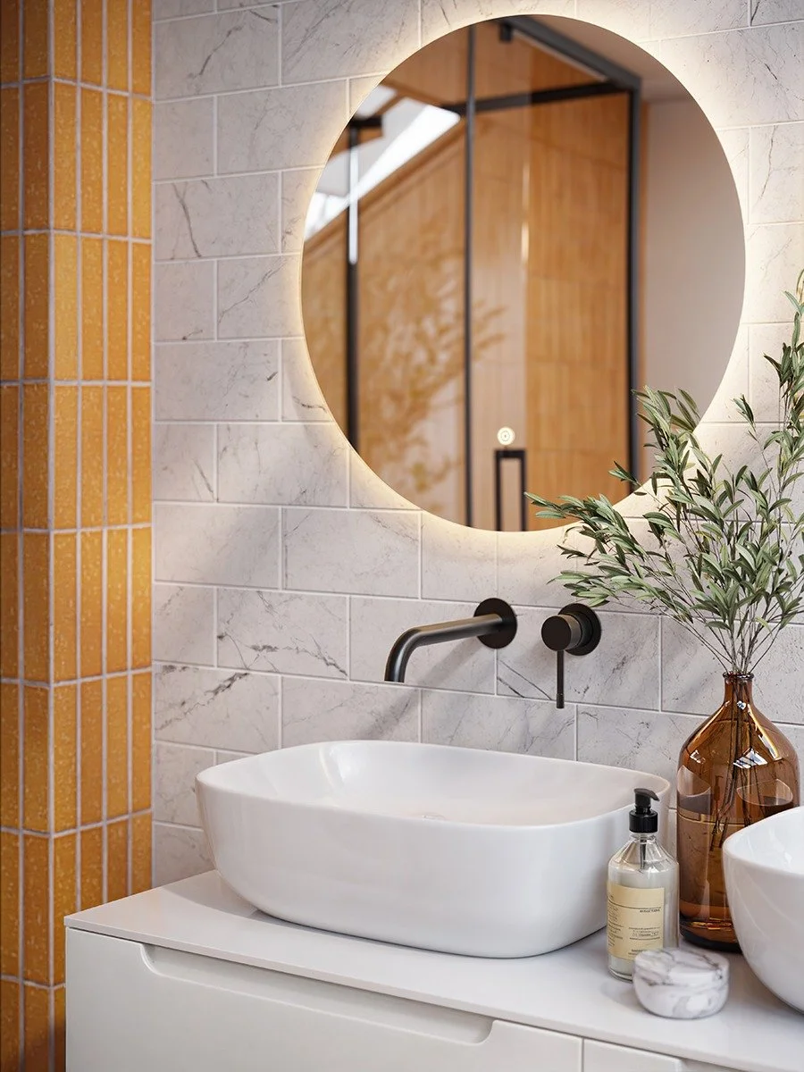 Modern bathroom with a white vessel sink, a wall-mounted black faucet, a round mirror with backlighting. Contemporary bathroom furniture on display in our Bournemouth bathroom showroom