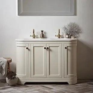 White bathroom vanity with gold fixtures, white wall with a mirror above. ~Traditional style taps and brassware available from Island Bathrooms