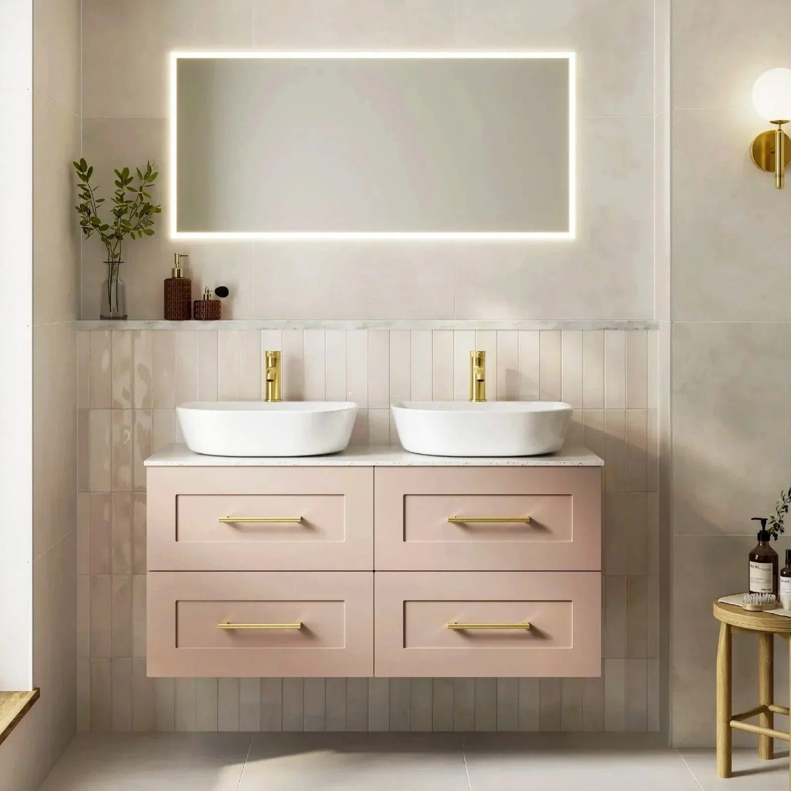 Contemporary  light pink vanity unit with statement mirror and stylish brassware. available in Island bathrooms 