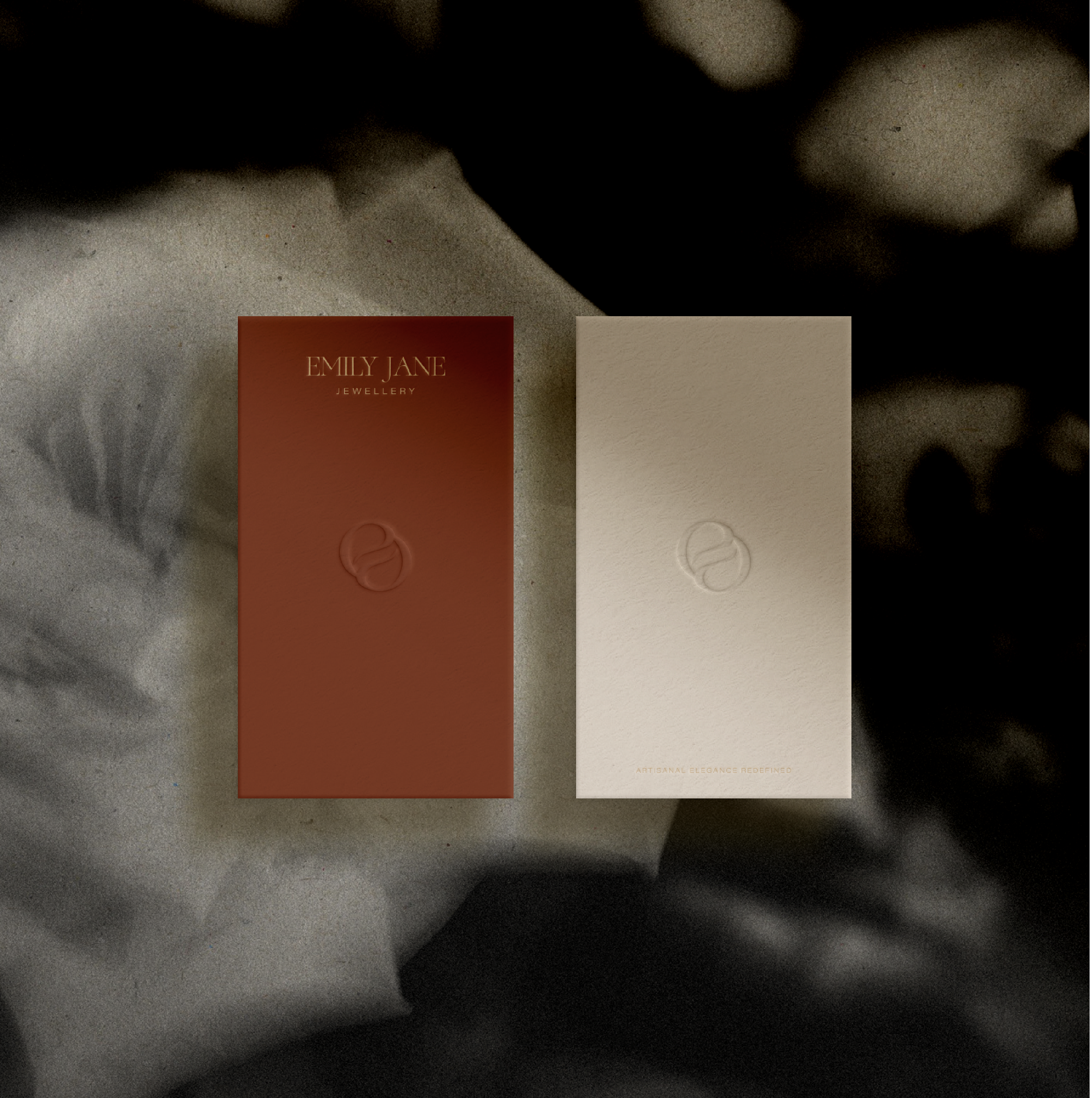 Close-up of a person reading a card from Emily Jane Jewelry with a beige background and the words "Artisan Jewelry Redefined" at the bottom.