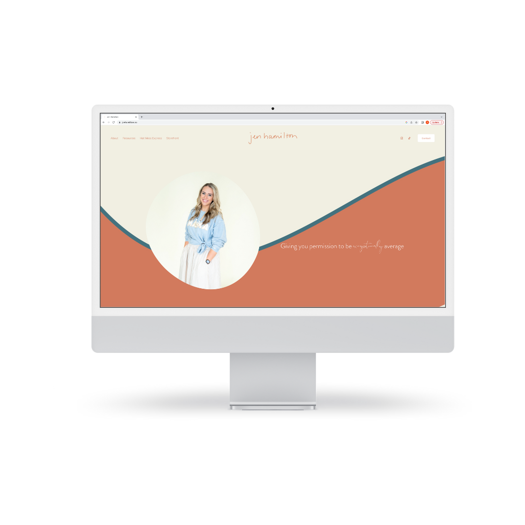 Desktop computer displaying a website with a woman in a blue shirt and white skirt, text on screen says "Giving you permission to be exceptionally average." Background is a wave of cream and terracotta colors.