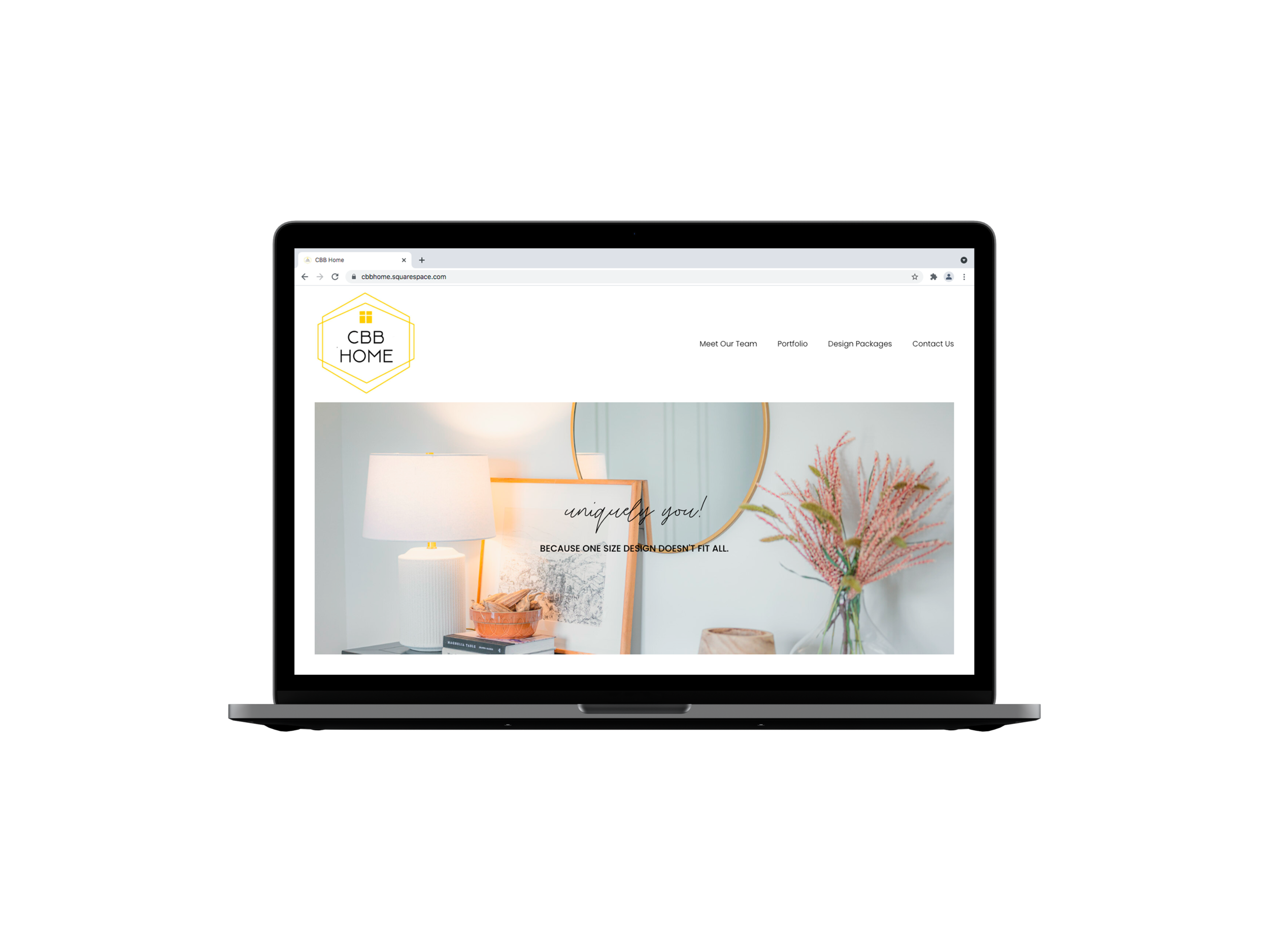 Laptop displaying a website for CBB Home with interior design elements, a lamp, decorative books, and plants on a table.
