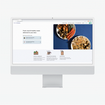 Computer screen displaying a meal delivery website featuring fresh ingredients and dish images.