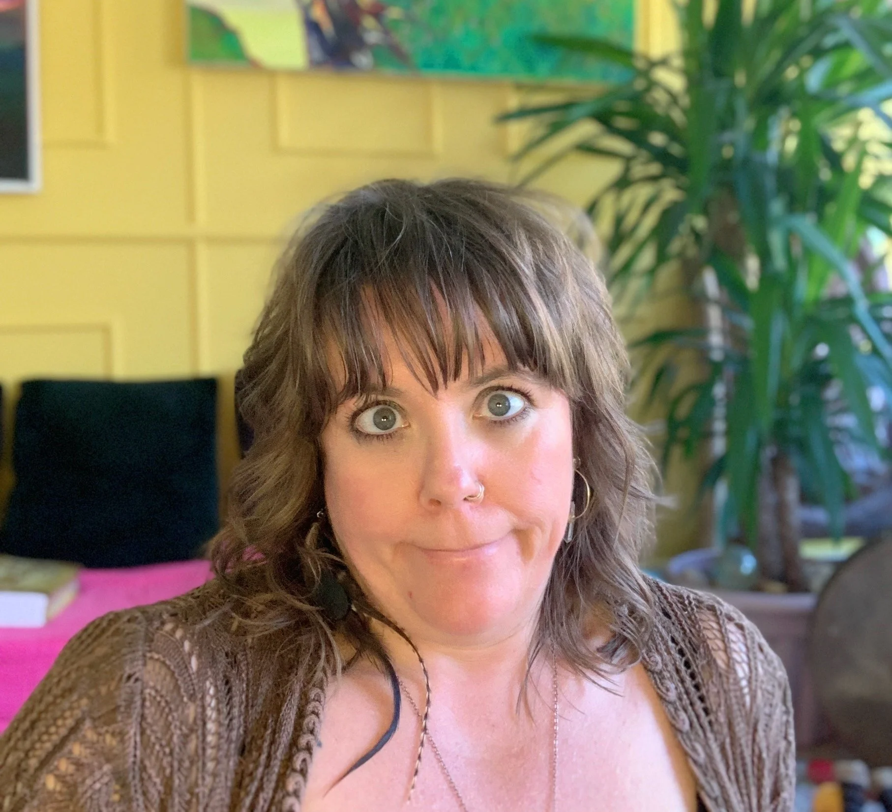 Eva, a white woman in her late 40's, pulling a face to make light of the serious life changes that are incoming.