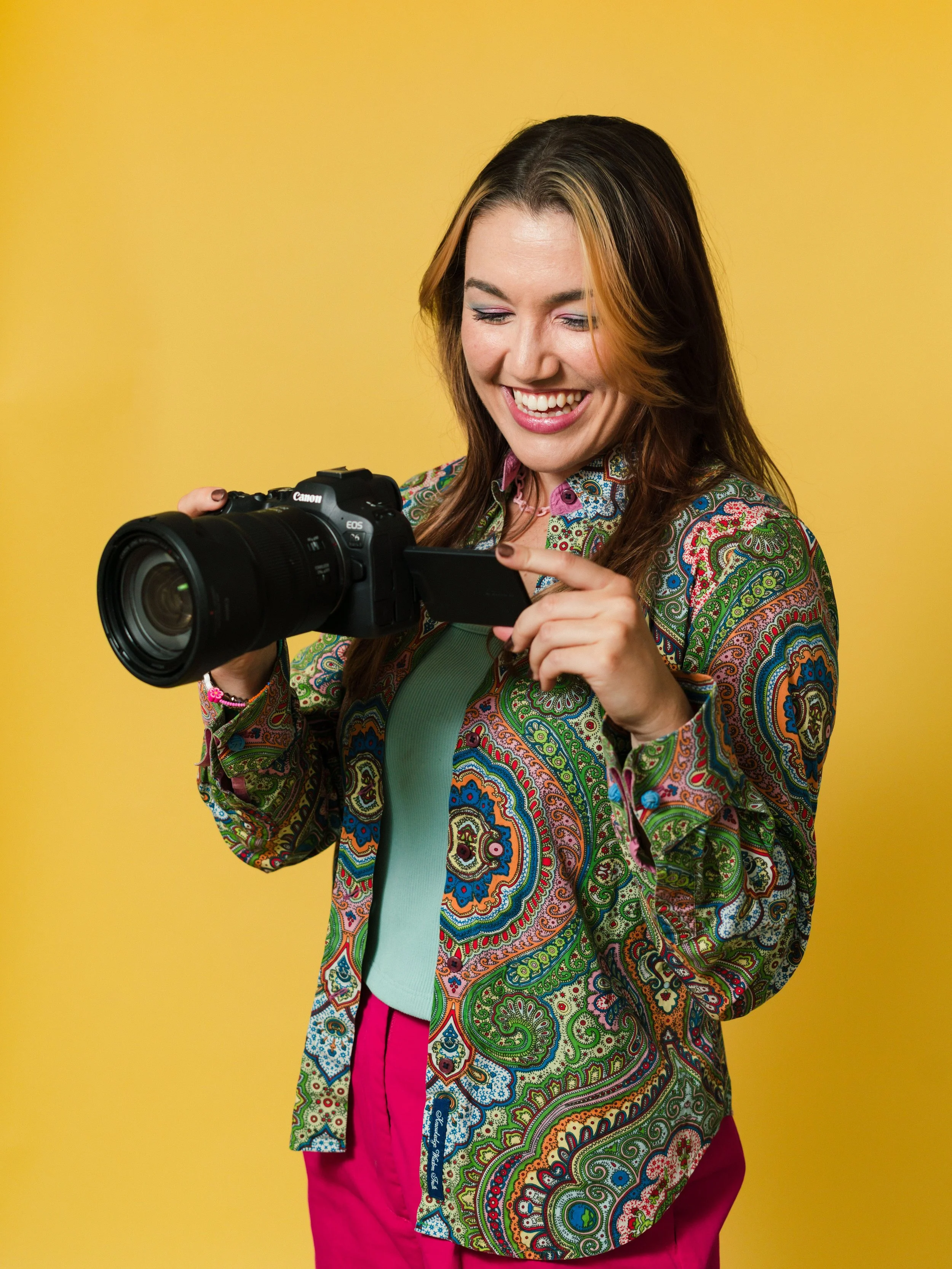 woman with camera outdoors