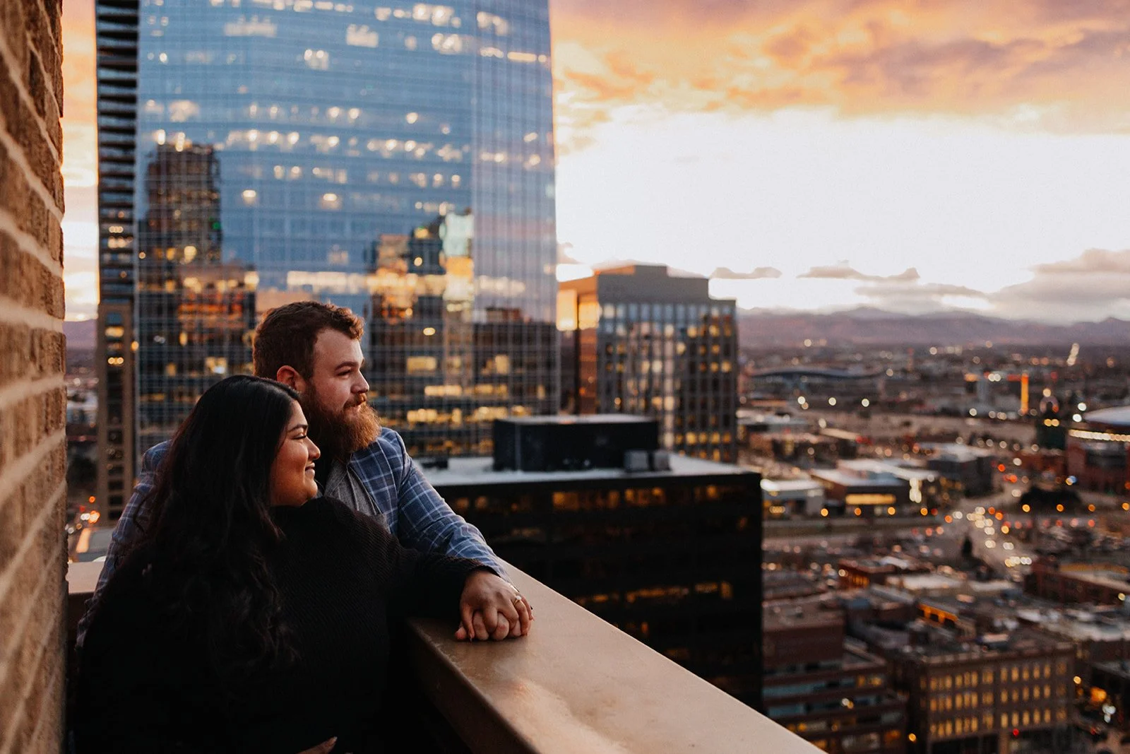Clock Tower Denver engagement photos looking over the city